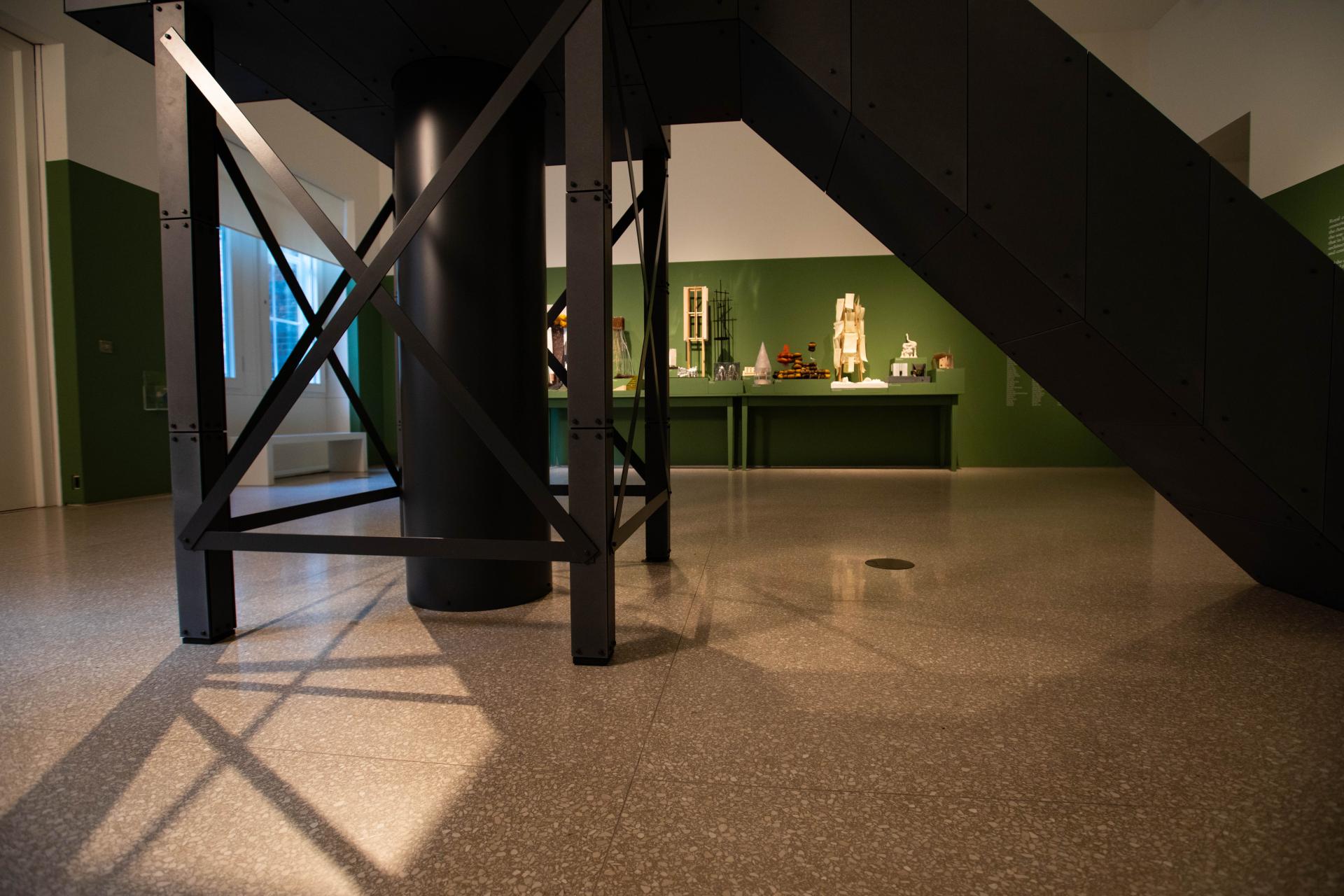 Exhibition view of John Hejduk's architectural models displayed at the Royal Academy of Arts, featuring innovative design elements.