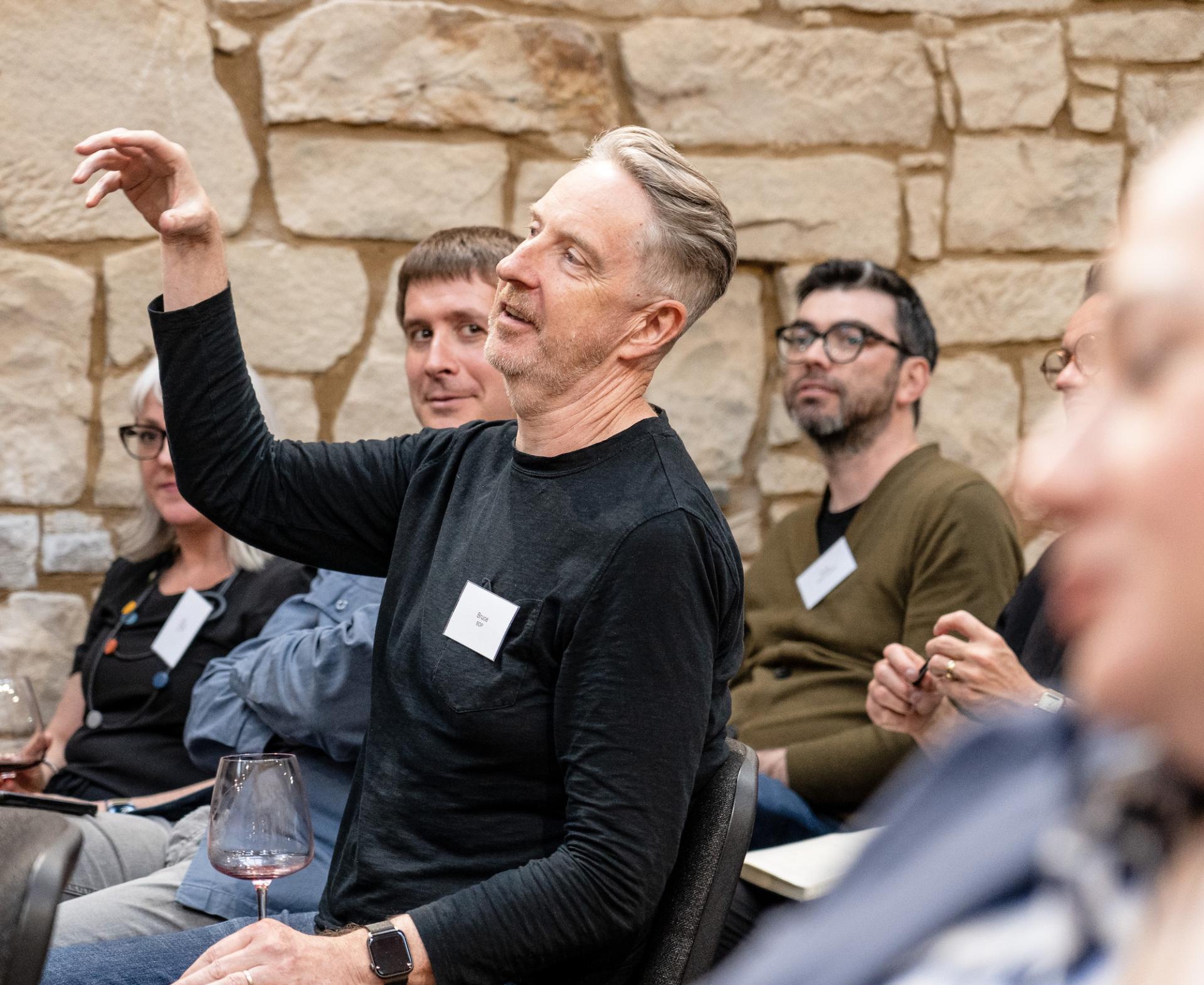 Participants engage in a lively discussion at the Glasgow Property Outlook seminar, sharing insights on local real estate trends.