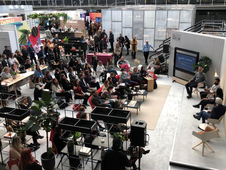 Crowd gathered at Workspace Design Show 2023, featuring discussions on innovative workspace design and sustainability.