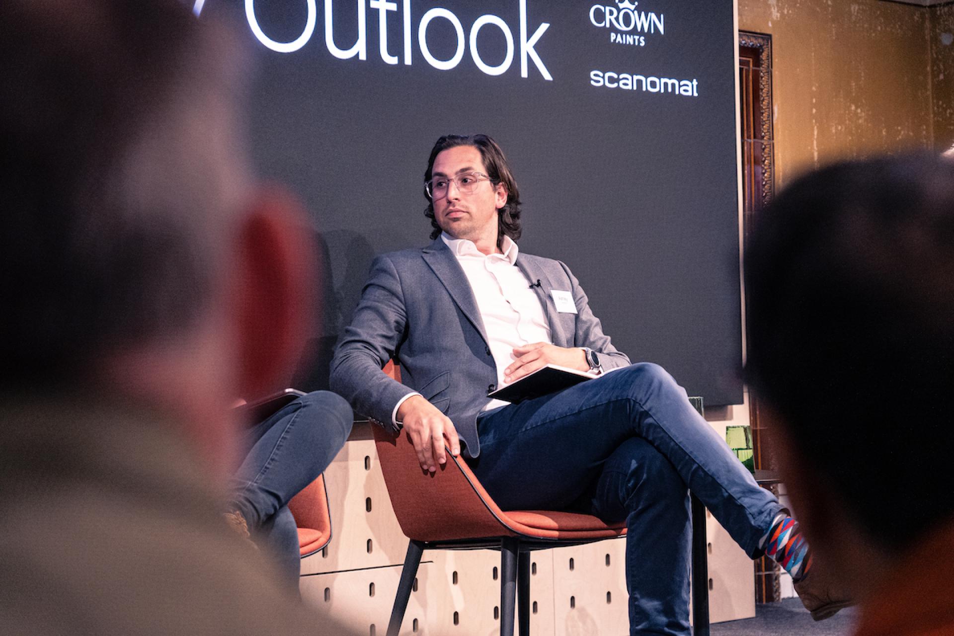 Panelist discussing Manchester property outlook at Material Source Studio seminar, featuring insights into local real estate trends.