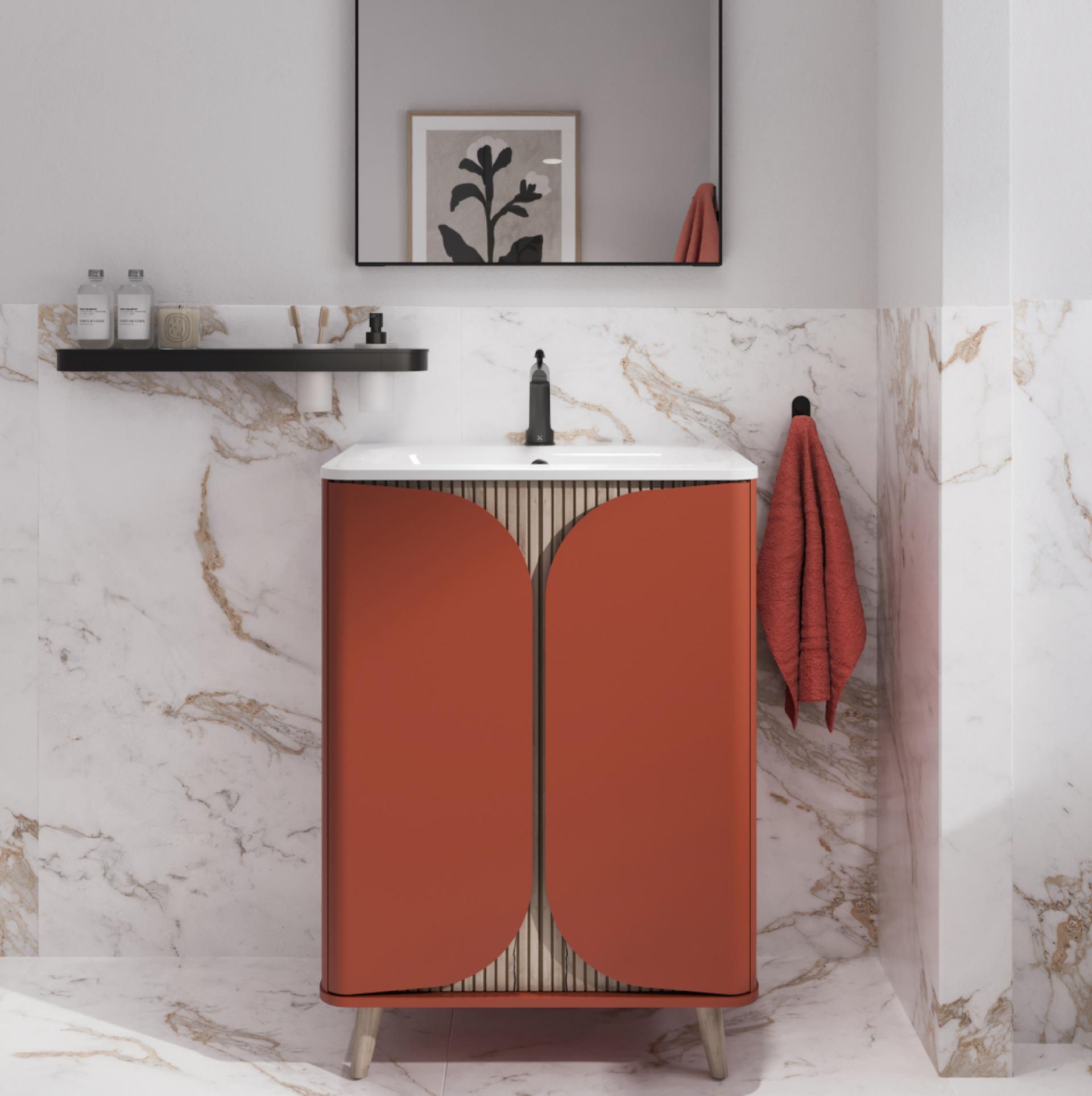 Stylish orange bathroom vanity with a white sink, modern faucet, and decorative mirror against marble walls.