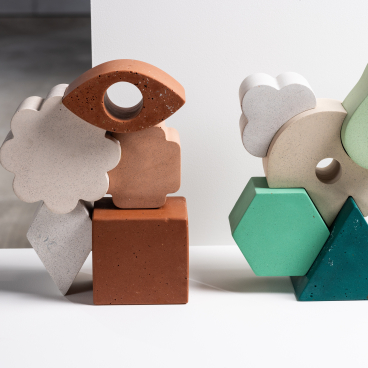 Colorful geometric sculptures made from reused materials, highlighting innovative design at Dundee Design Festival 2024.