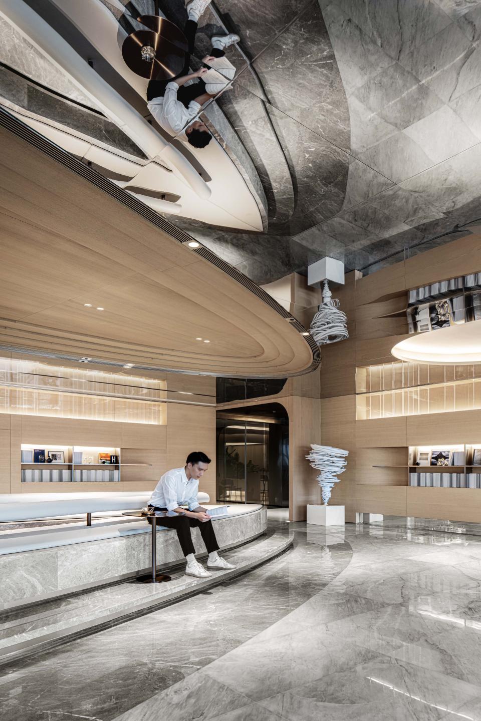 Stylish interior of Foshan Vanke Financial Centre featuring sleek seating and contemporary sculptures, showcasing Karv One's Unbound Ark project.
