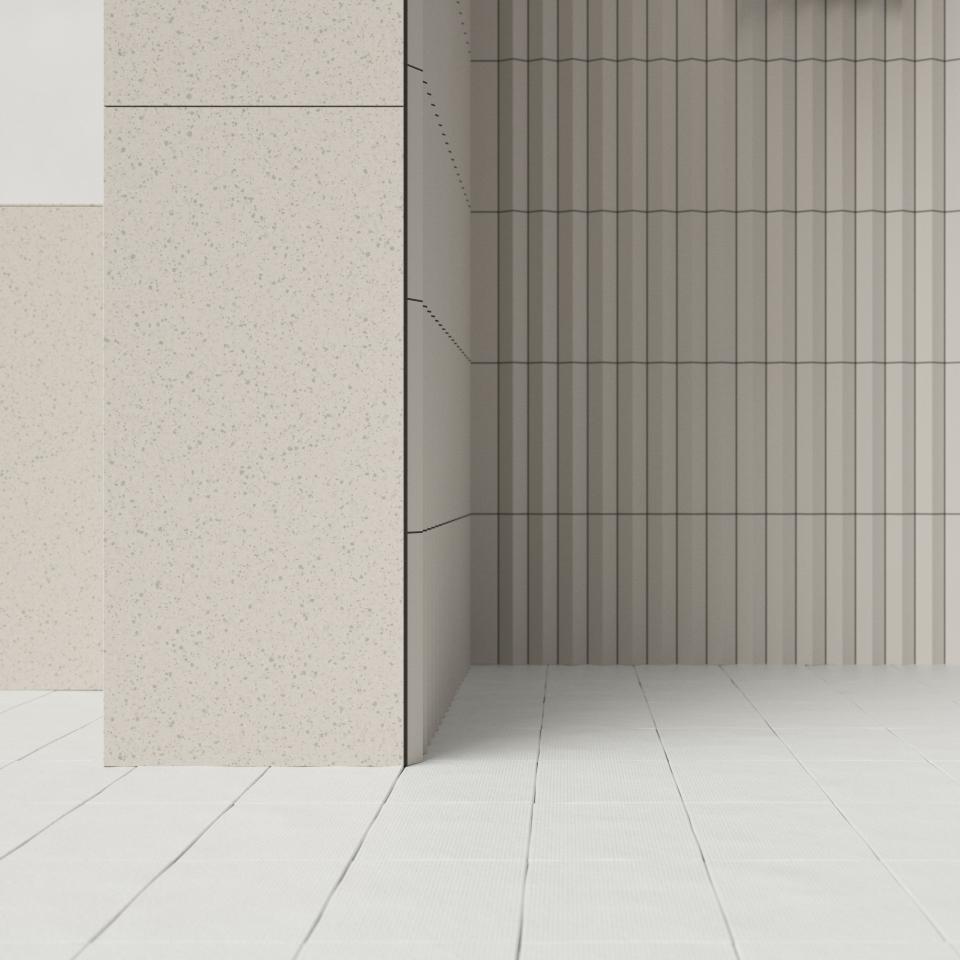 Elegant interior featuring textured porcelain tiles and modern ceramic wall design from Mutina and OEO Studio collaboration.