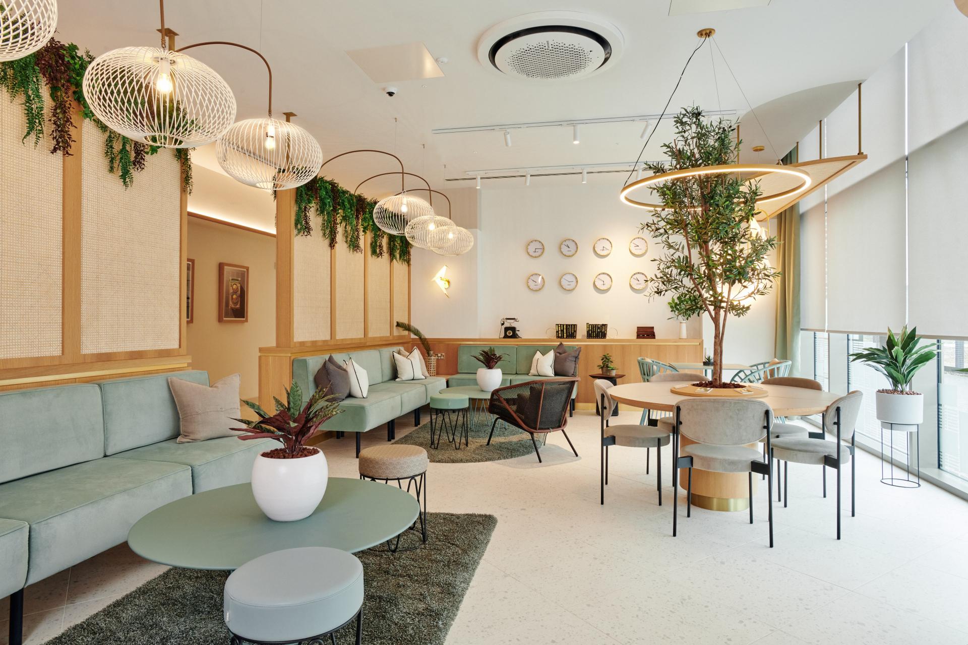 Modern residential amenity space at The Headline, featuring stylish seating, ambient lighting, and greenery for Grainger plc.