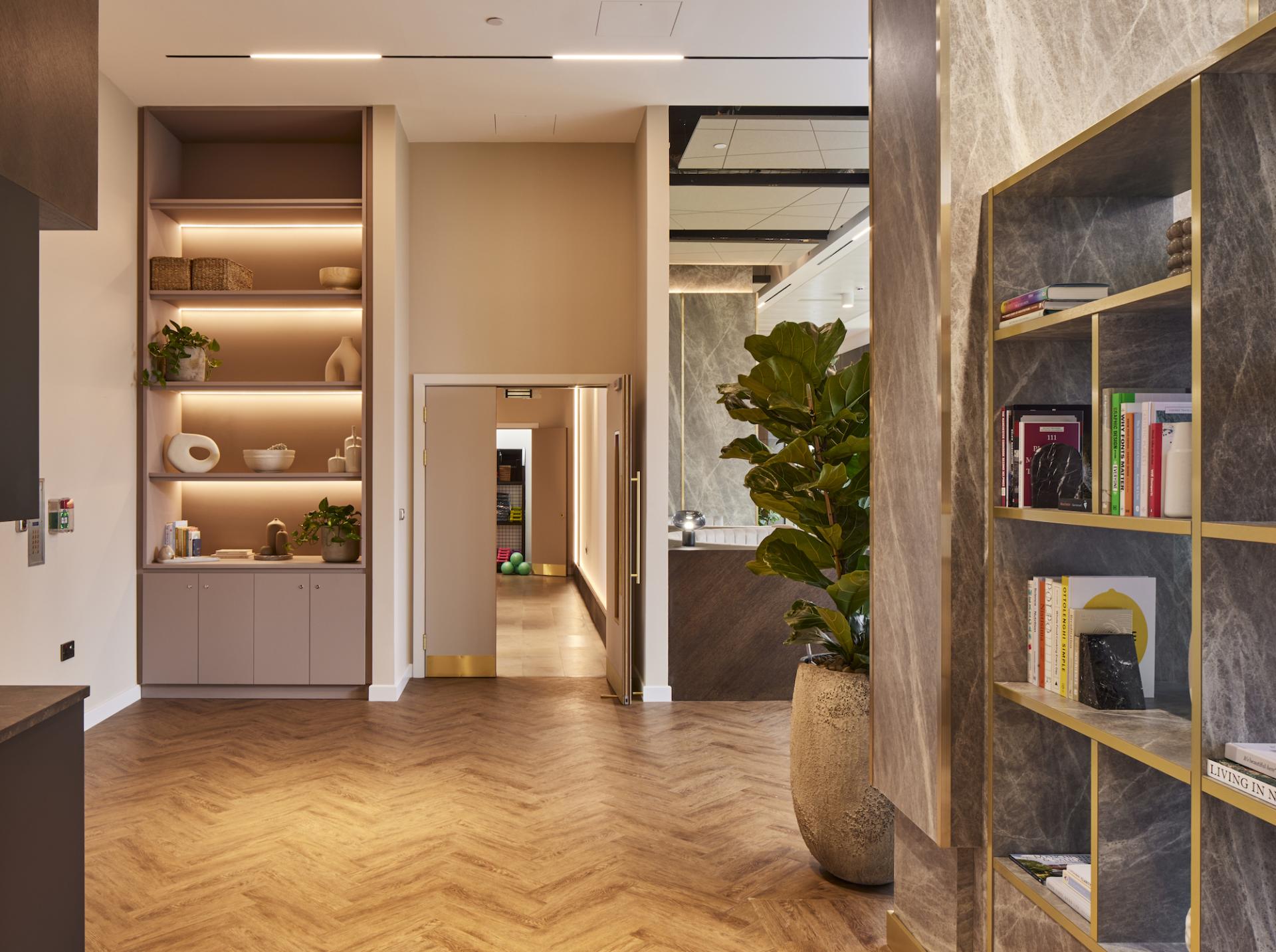 Modern residential amenity space designed by SpaceInvader, showcasing elegant interiors and warm lighting.