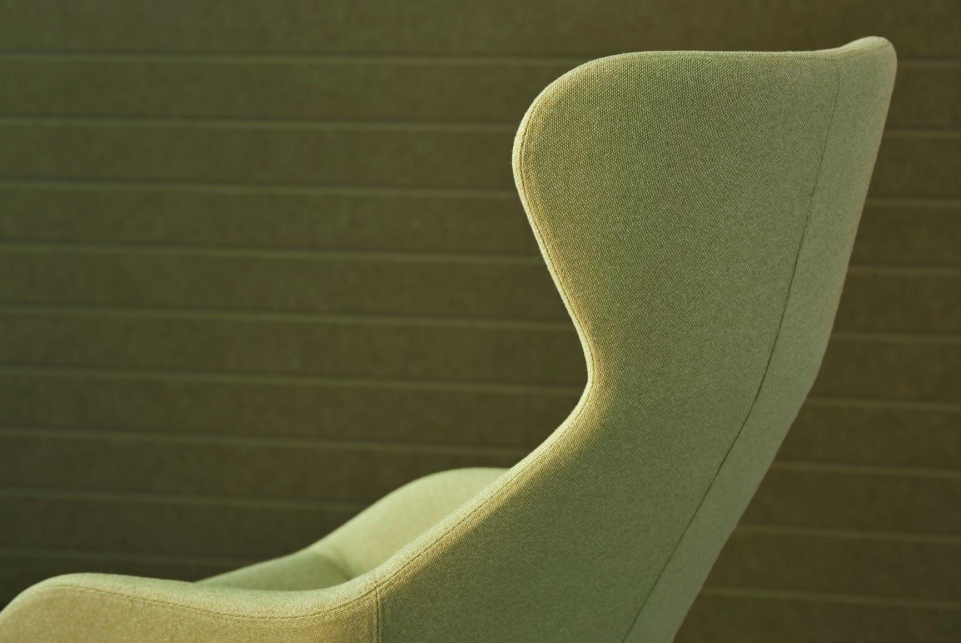 Wool-rich green upholstery chair from Woven Image’s Airport range, showcasing new textile colors for modern interiors.