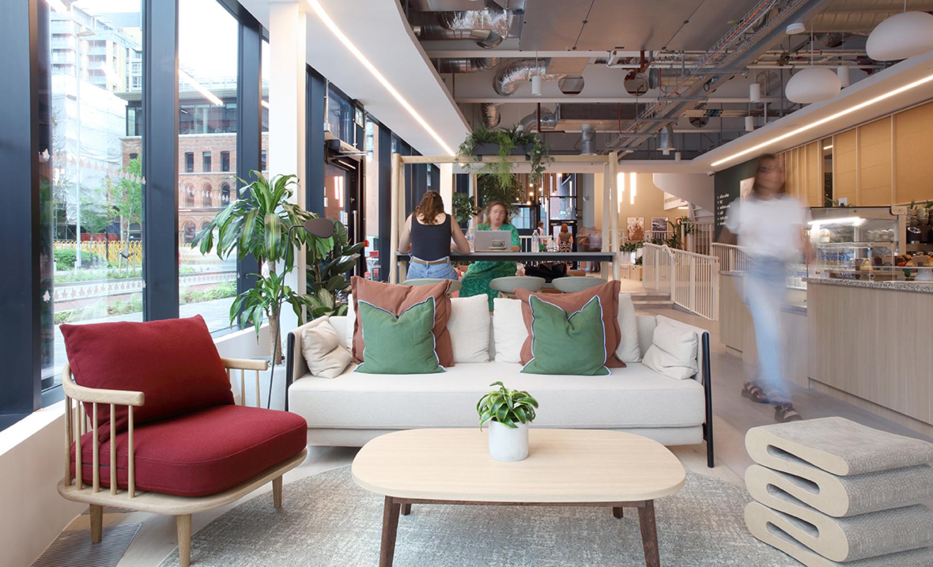 Modern social hub in Eden, New Bailey, featuring cozy seating, plants, and a welcoming atmosphere for community engagement.