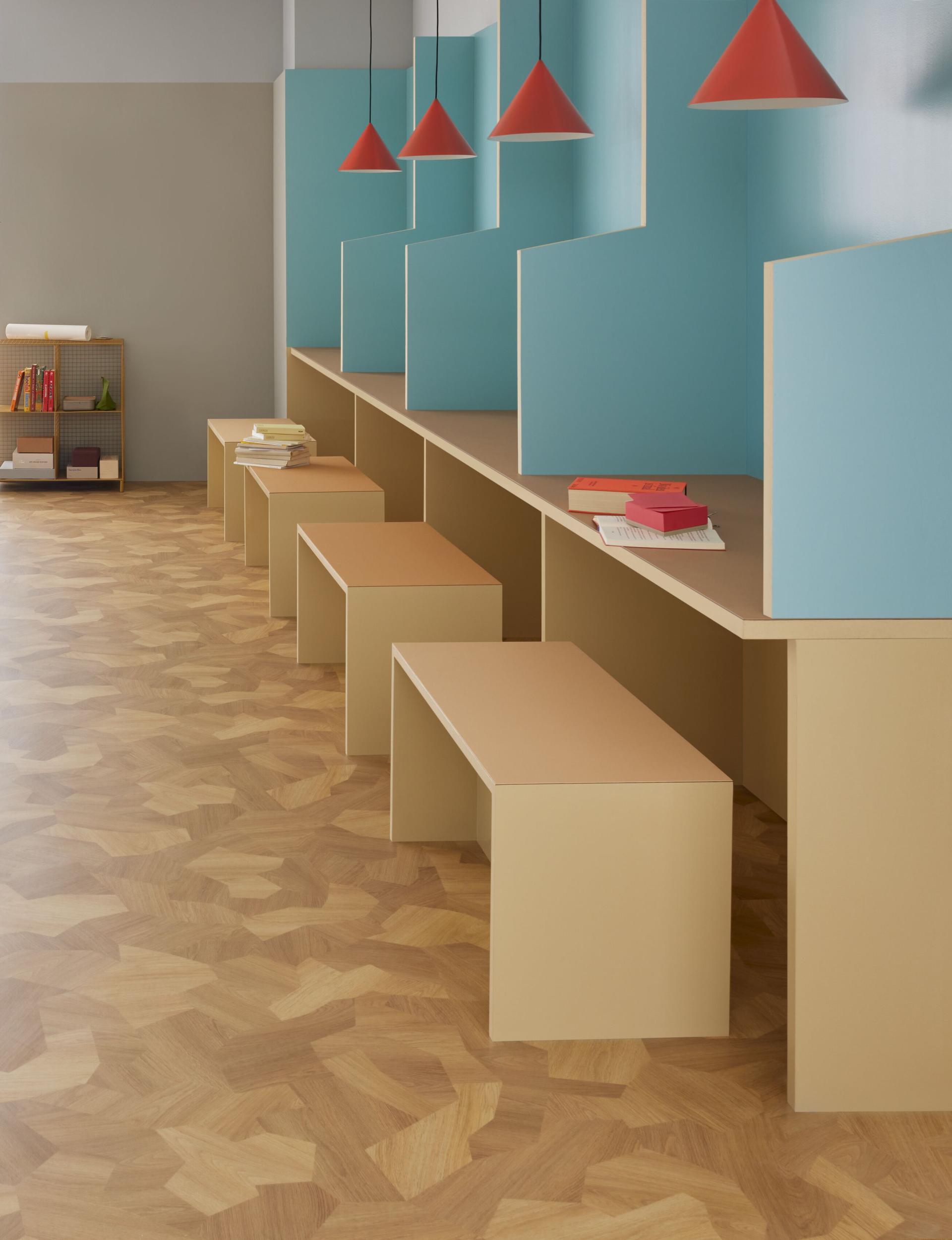 Benches and tables sit on top of Forbo flooring