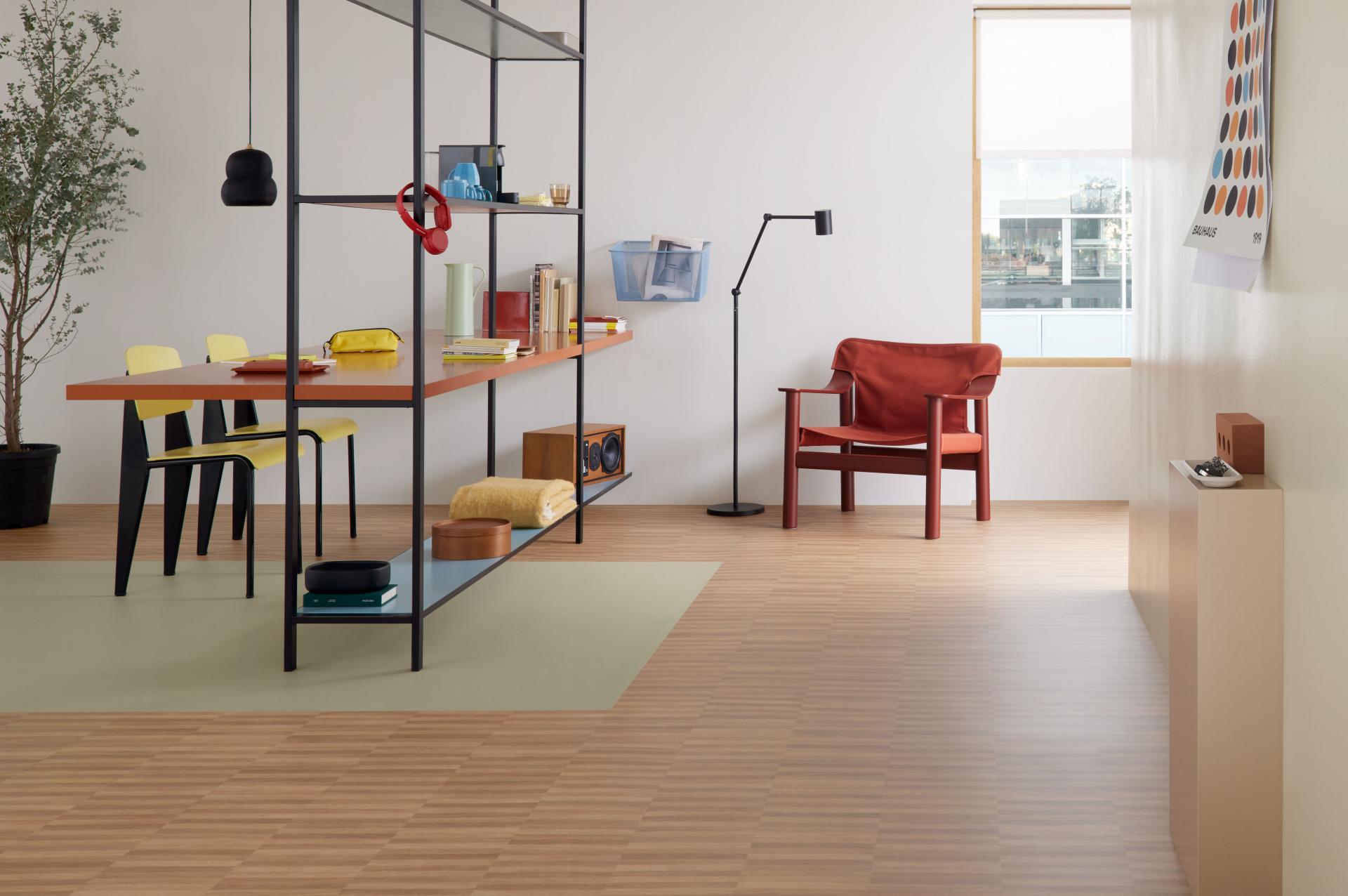An array of furniture including chairs, tables and shelves are showcased next to Forbo flooring