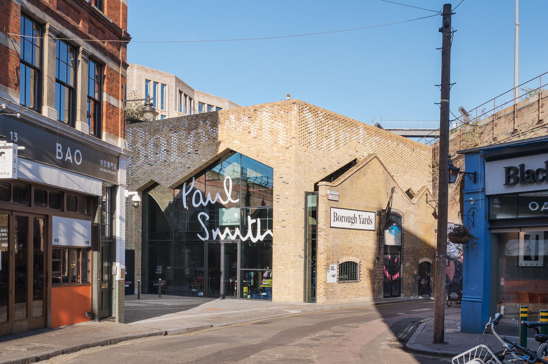 Borough Yards featuring the Paul Smith store, showcasing modern architecture and vibrant shopping in London.