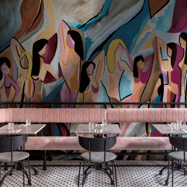 Vibrant mural featuring abstract figures, showcasing organic shapes and colors, enhancing the atmosphere of a modern dining space.