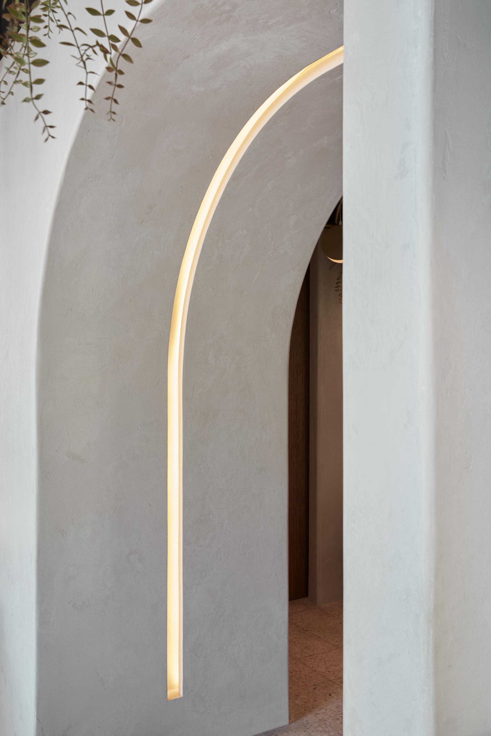 Contemporary archway with warm lighting, showcasing the modern design transformation of Mezza House in Dubai.