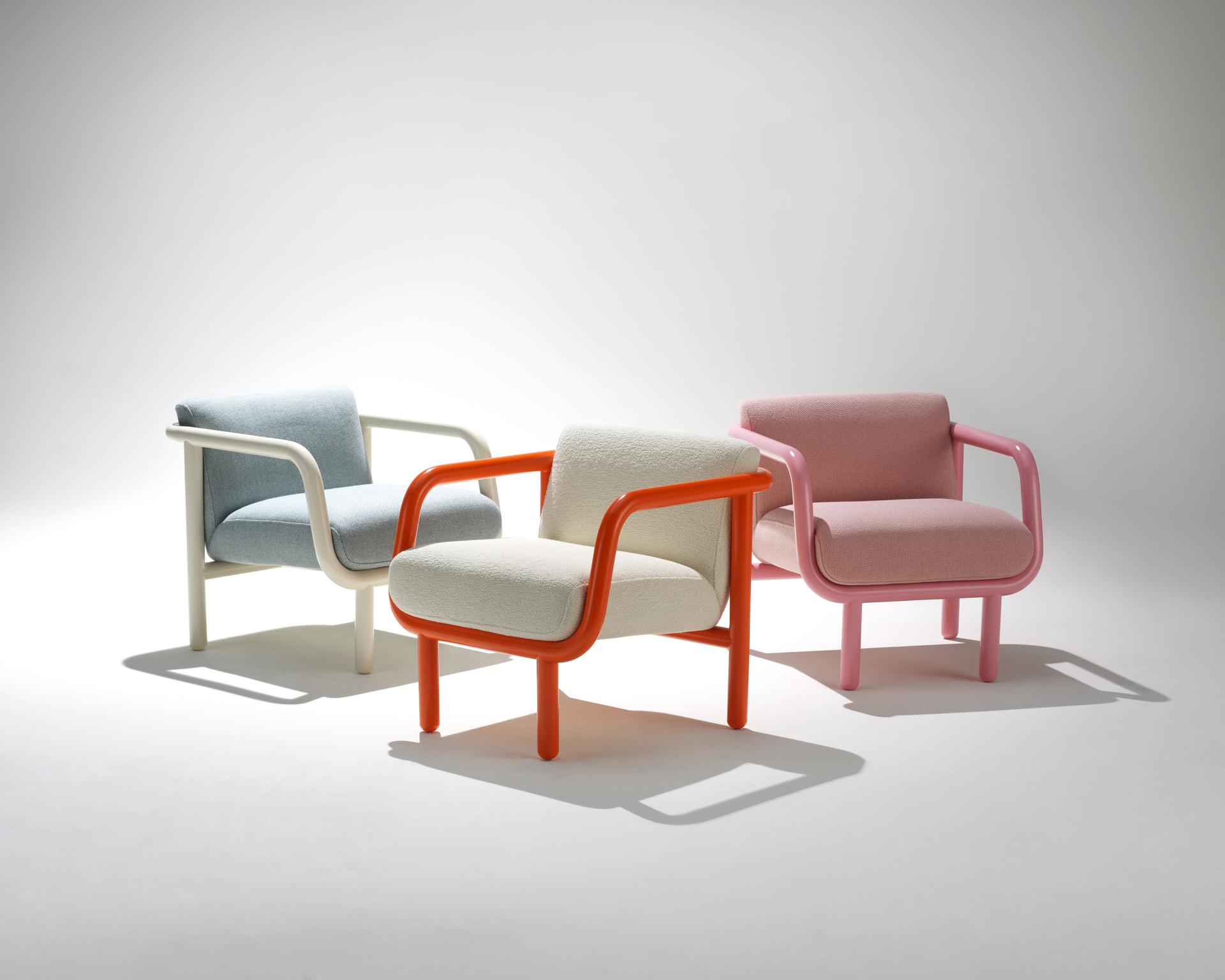 Colorful mid-century inspired lounge chairs from NaughtOne, showcasing versatile design and bold aesthetics, perfect for modern interiors.