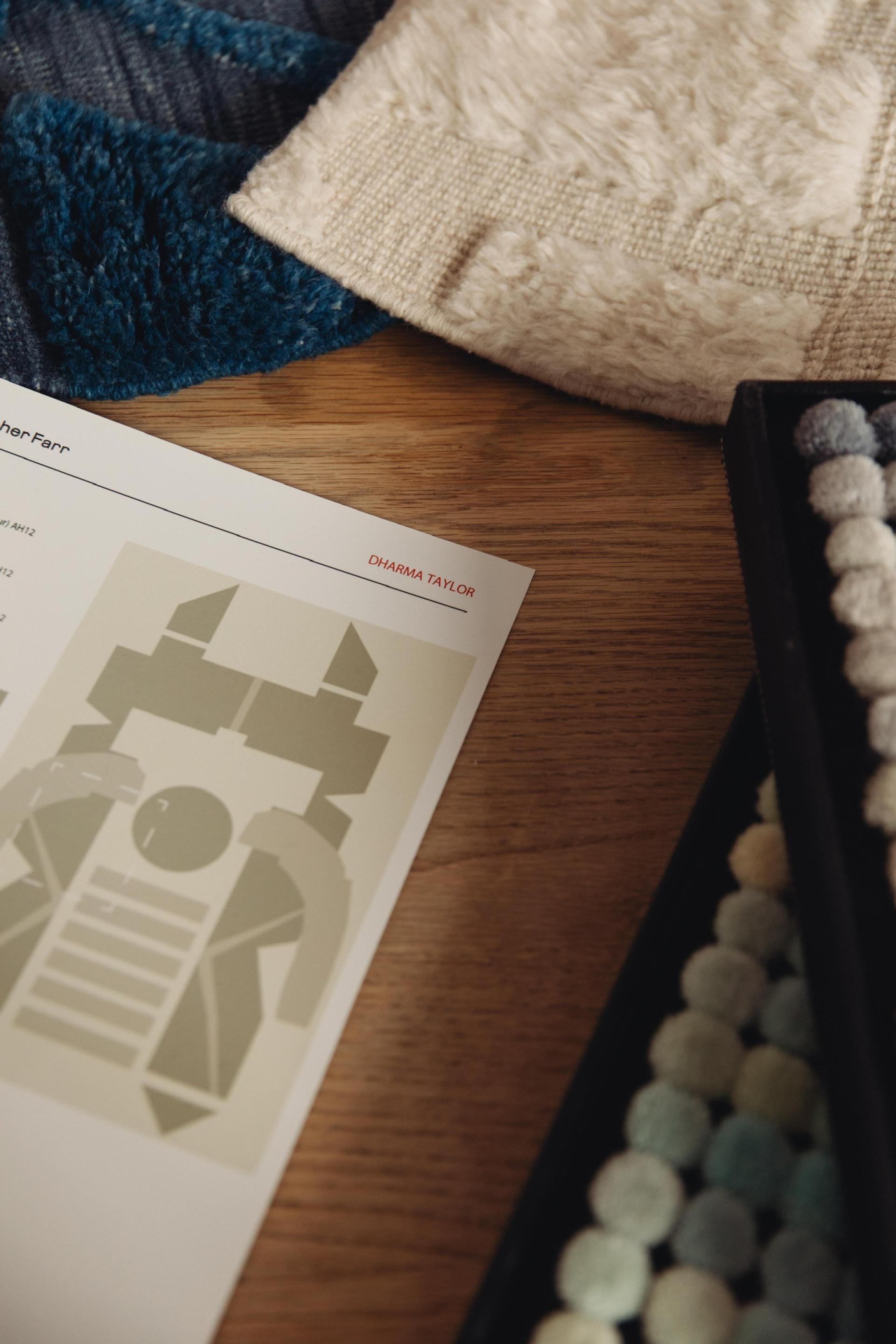 Textiles and a color palette sheet by Dharma Taylor, highlighting elements of memory and material narratives.