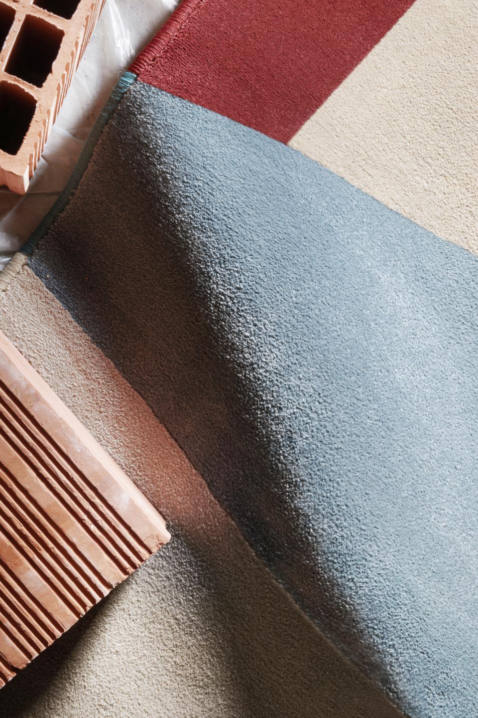 Textured fabric swatches and a terracotta brick, showcasing design elements for Serena Confalonieri's 13.10 Ristorante project.