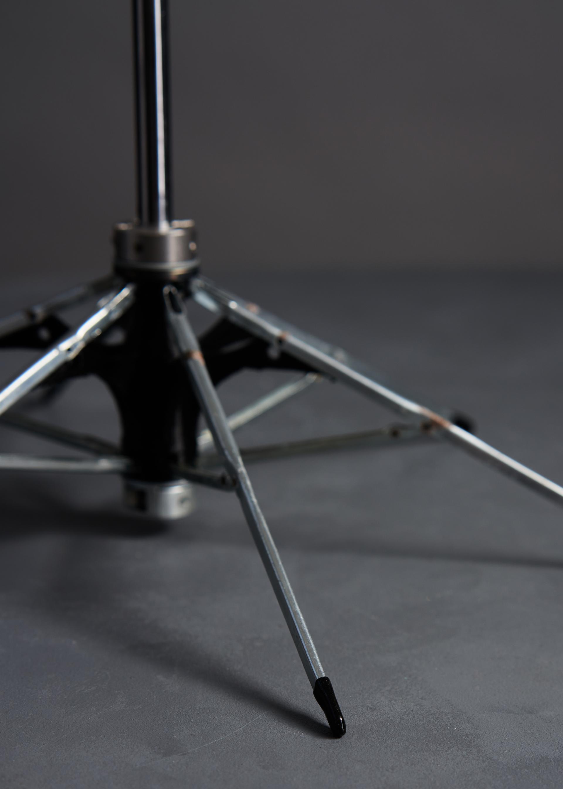 Repurposed lamp base made from upcycled umbrella parts, showcasing innovative design and sustainable practices.