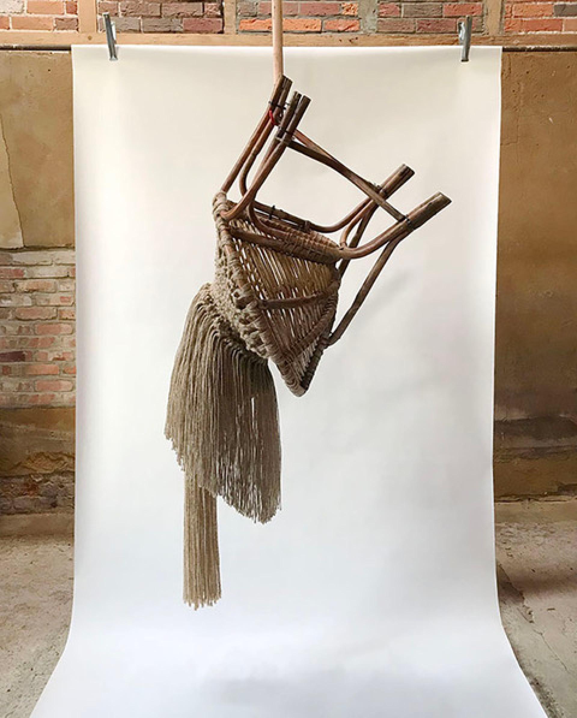 Woven wall hanging made of natural materials, showcasing intricate design, featured at London Craft Week 2024.