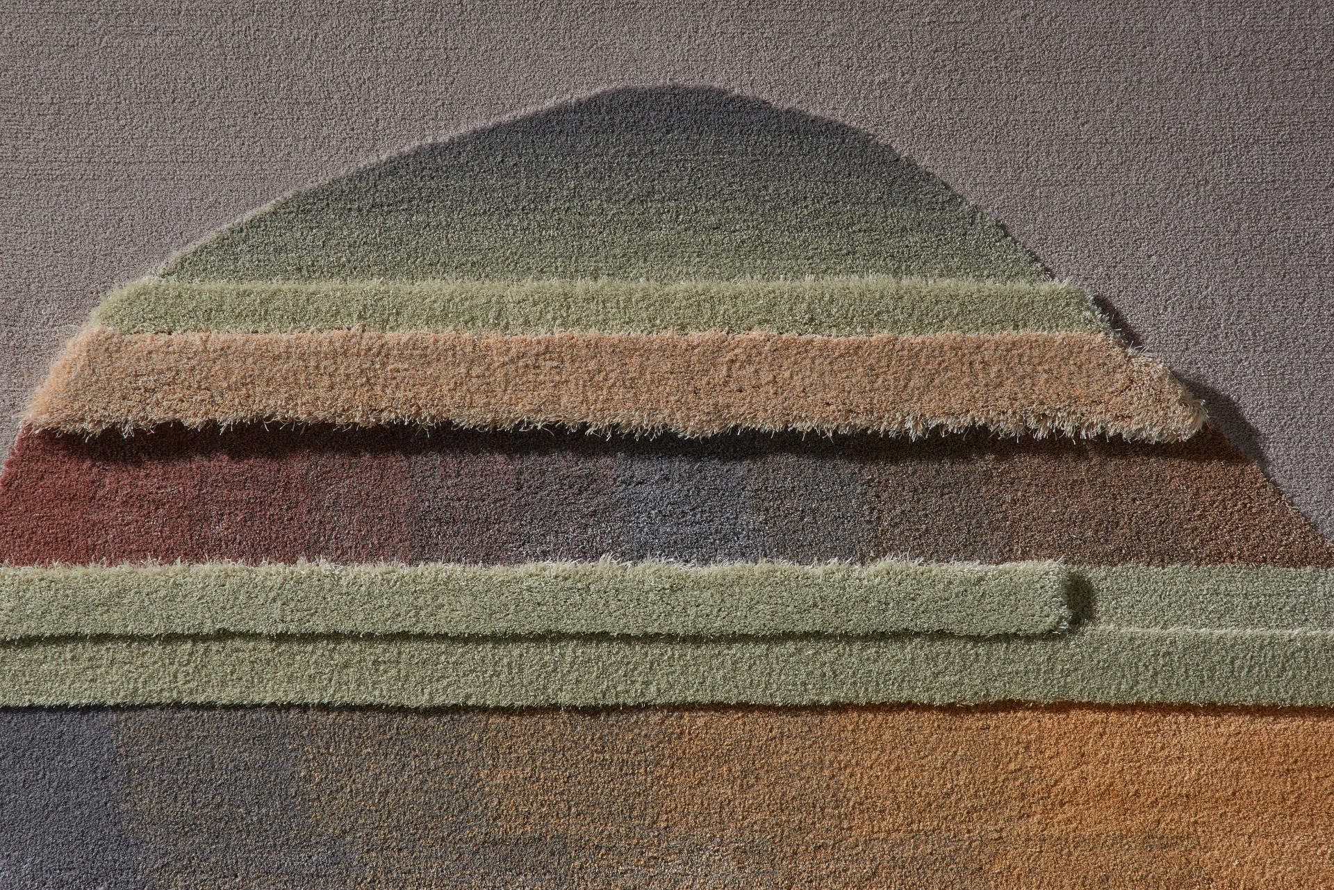 Layered textile materials in earthy tones illustrate innovative crafting techniques from the Baltic region's design community.