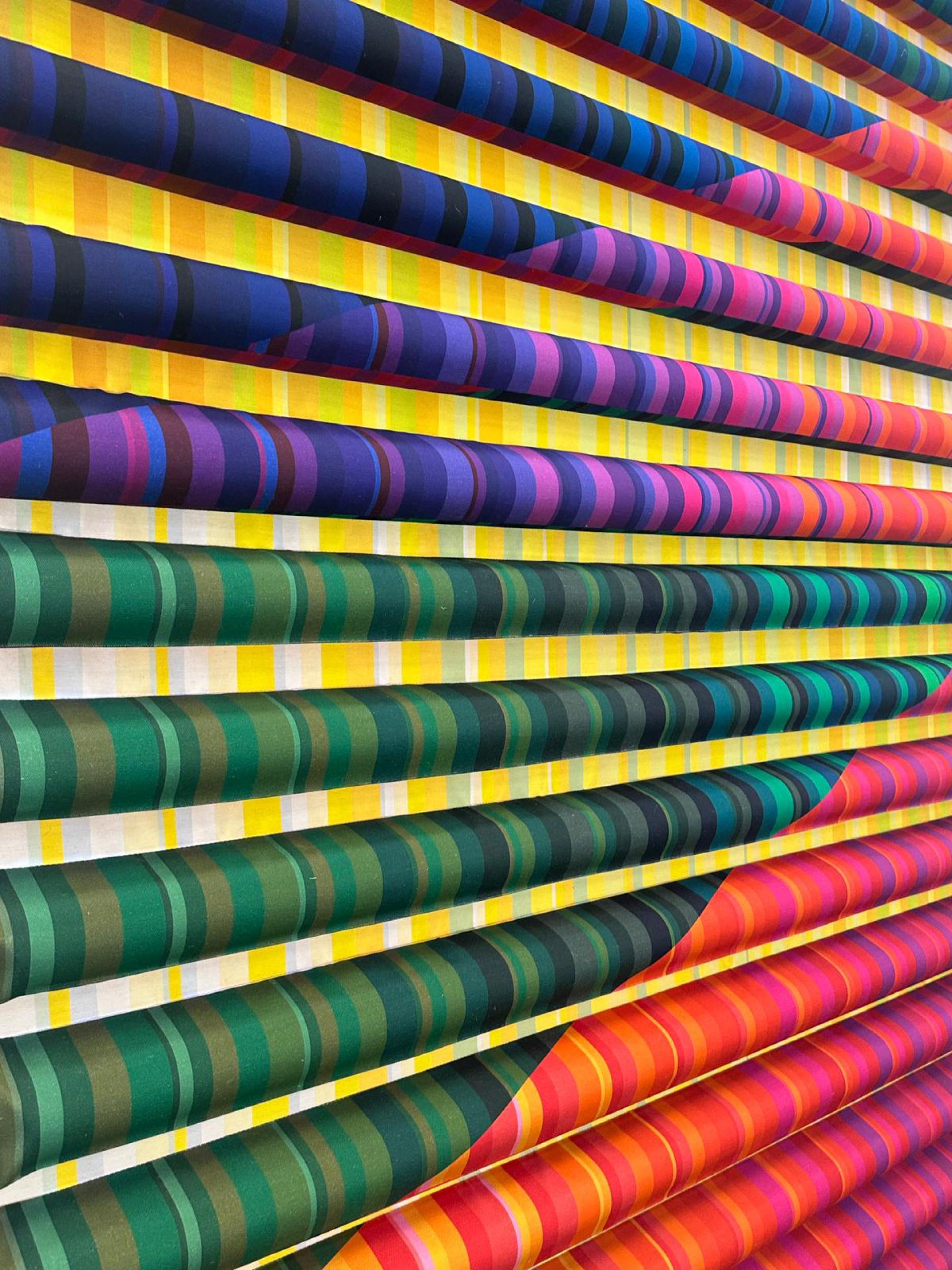 Colorful textile artwork featuring vibrant patterns and stripes, created by Margo Selby for the National Festival of Making.