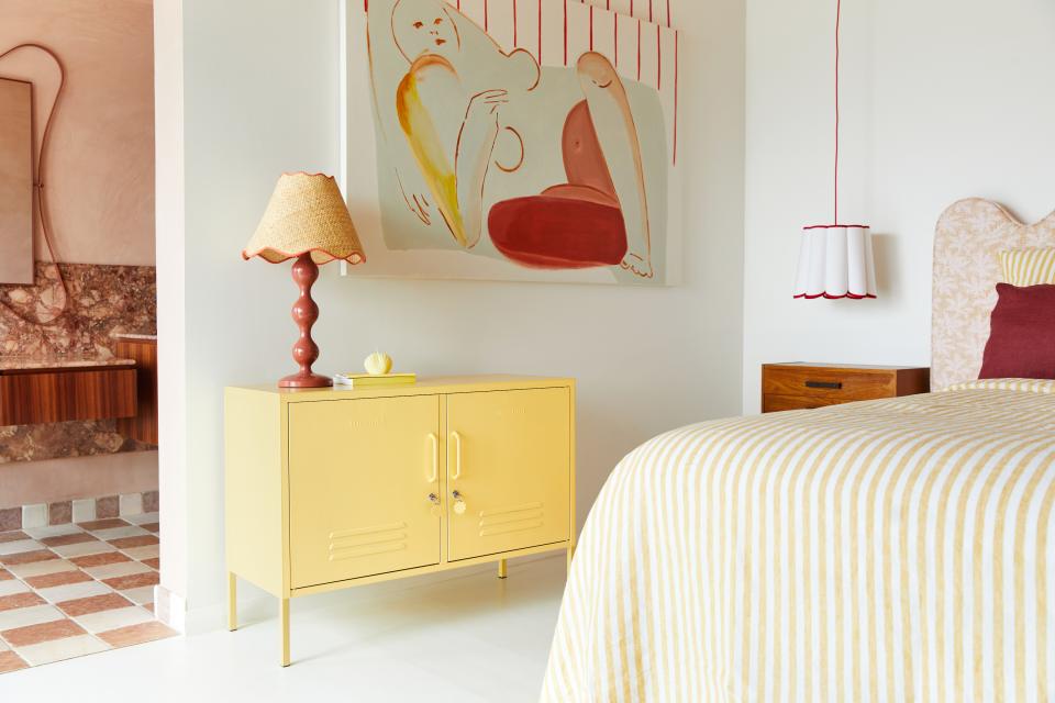 Stylish bedroom featuring Mustard Made's new Butter cabinet, a colorful lamp, and modern decor elements.