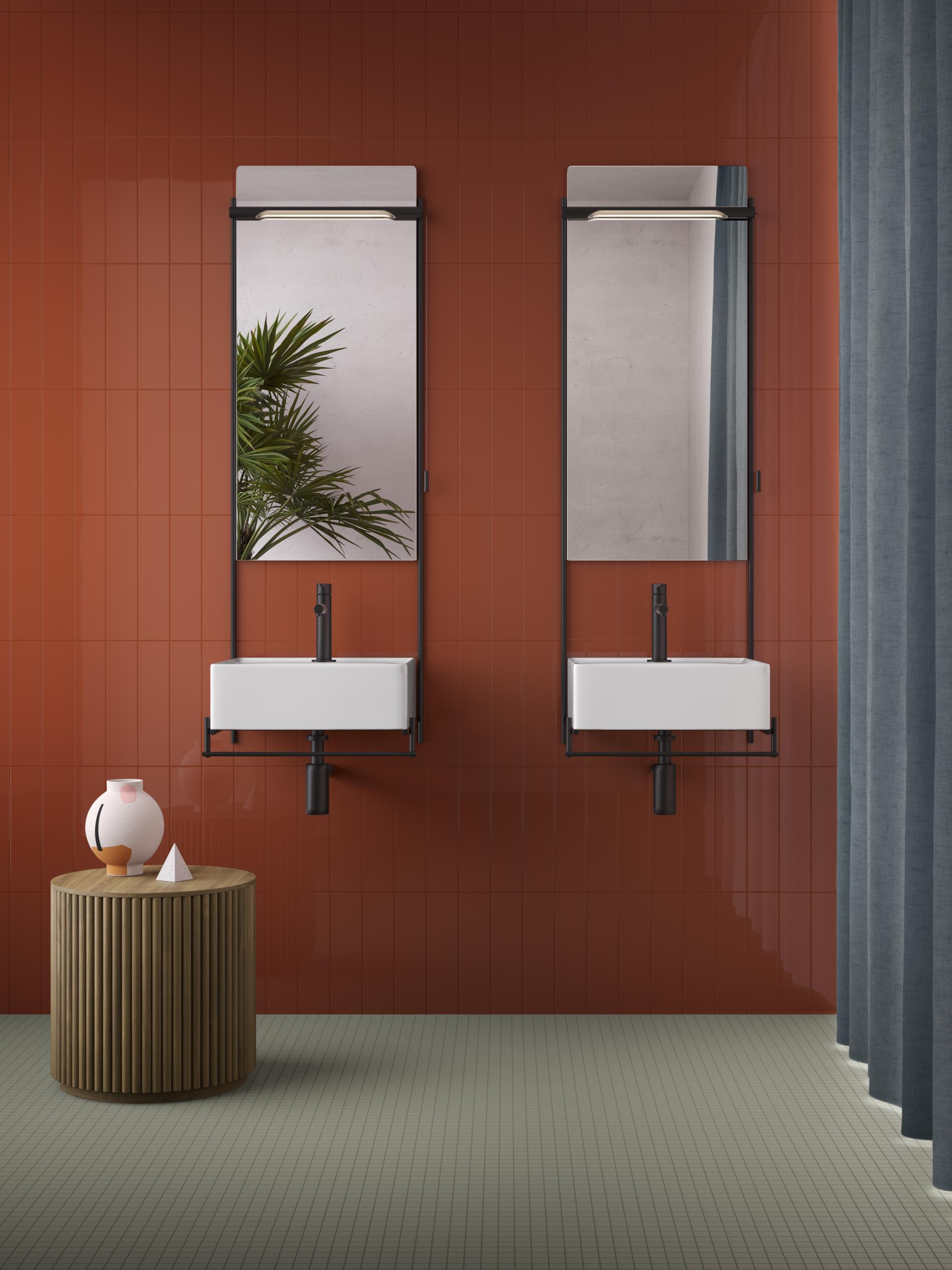 Modern bathroom design featuring VitrA's Equal collection with minimalistic sinks, stylish mirrors, and terracotta wall tiles.
