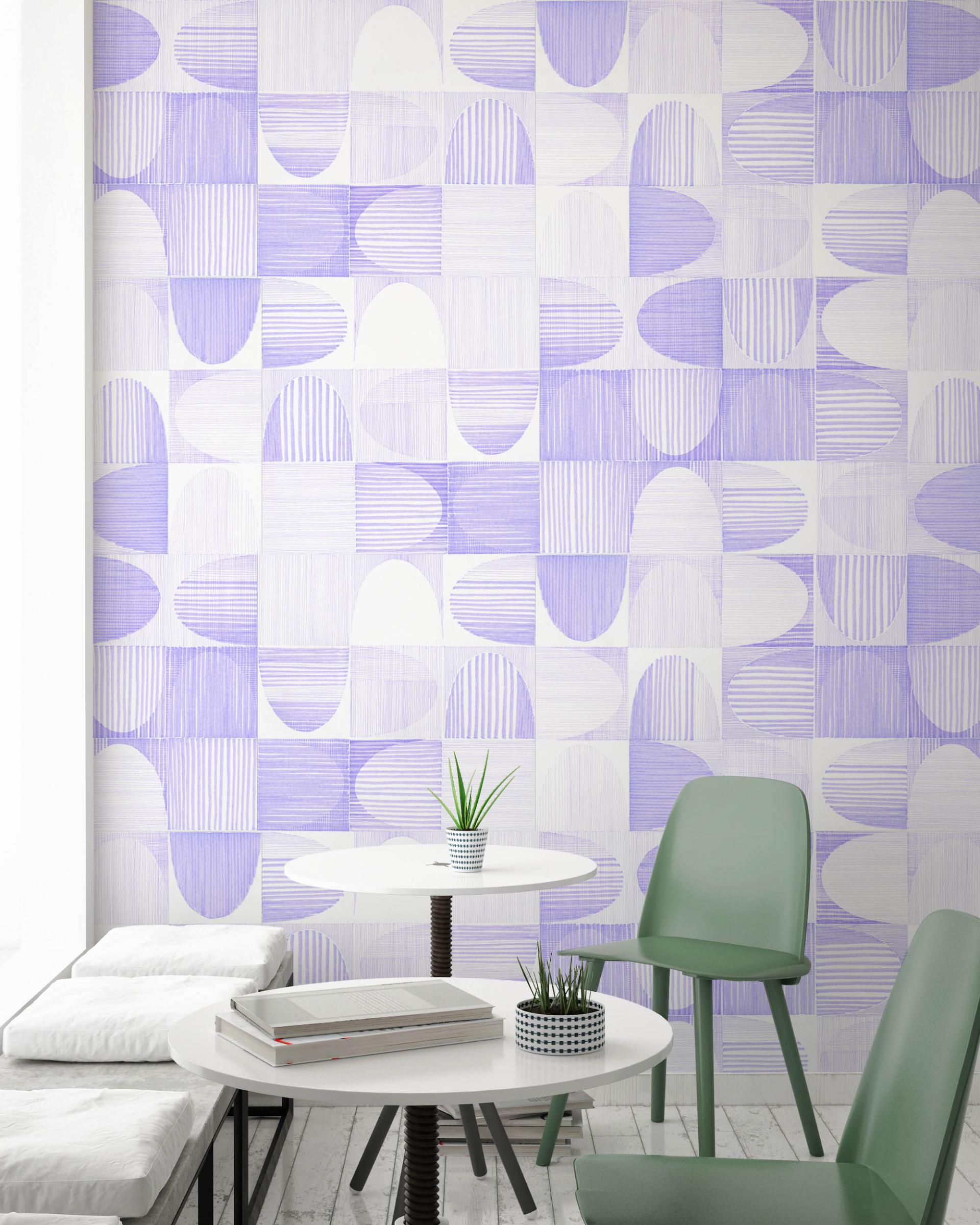 Geometric wallcovering in lavender tones adorns a modern cafe setting with minimalist furniture and plants.