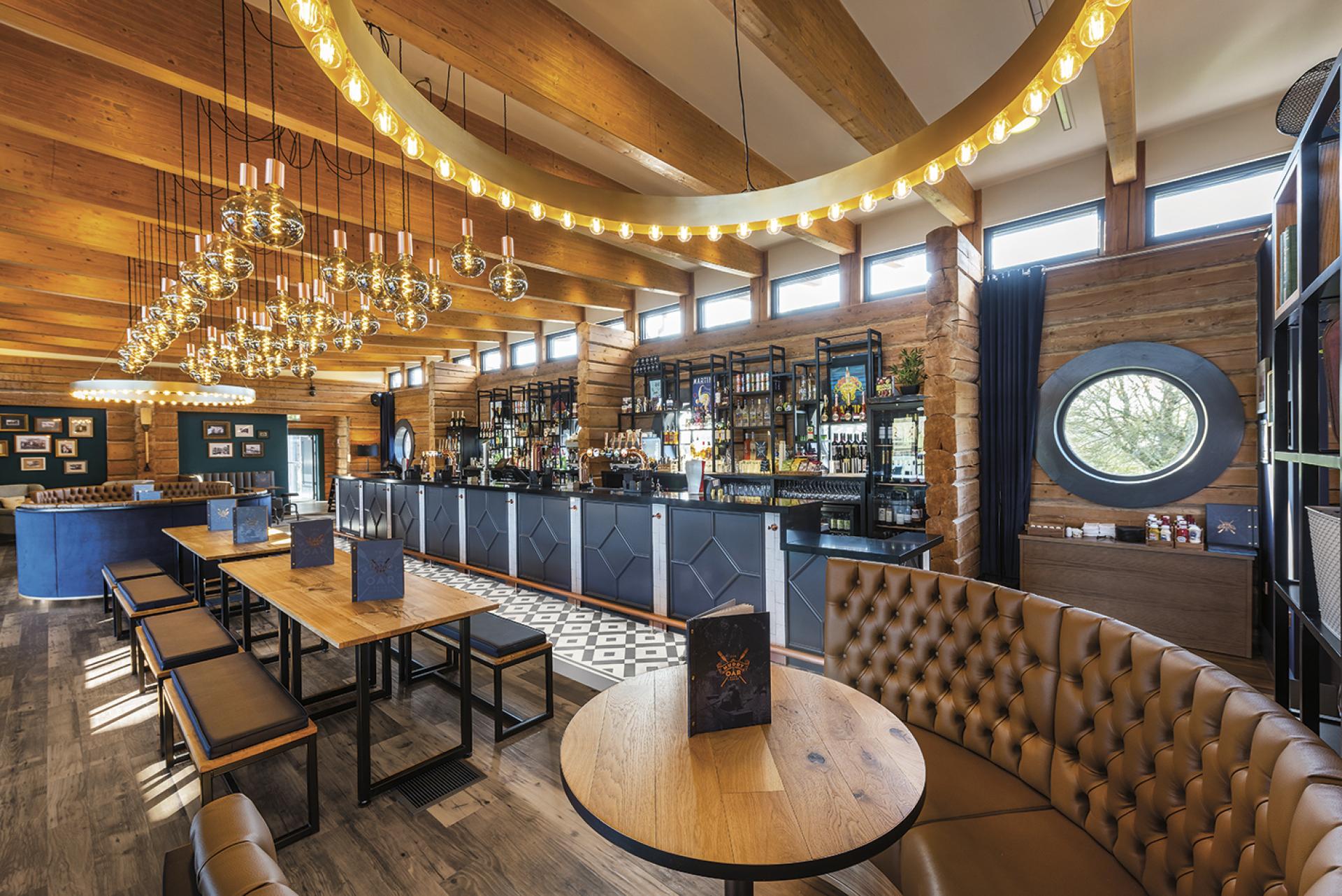 Refurbished interior of The Muddy Oar pub featuring nautical decor, wooden beams, and stylish lighting in Stratford-Upon-Avon.