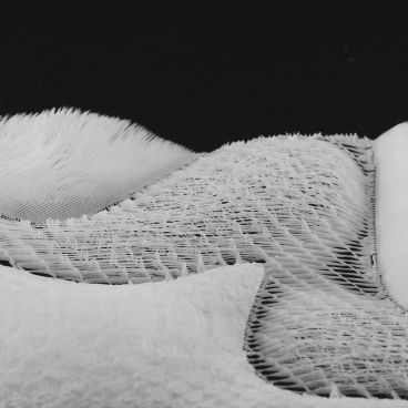 Textured white material samples showcasing innovative design in new materials, highlighting OPT Industries' unique approach to sustainability.