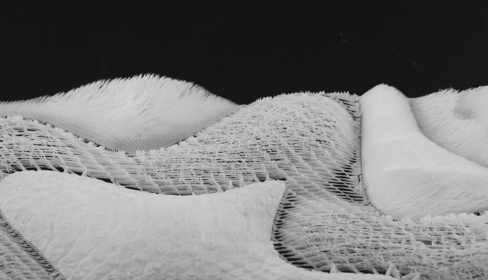 Textured white material samples showcasing innovative design in new materials, highlighting OPT Industries' unique approach to sustainability.