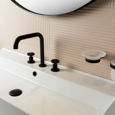 Sleek black faucet and accessories atop a modern white sink, showcasing elegant design for contemporary bathrooms in Dubai.