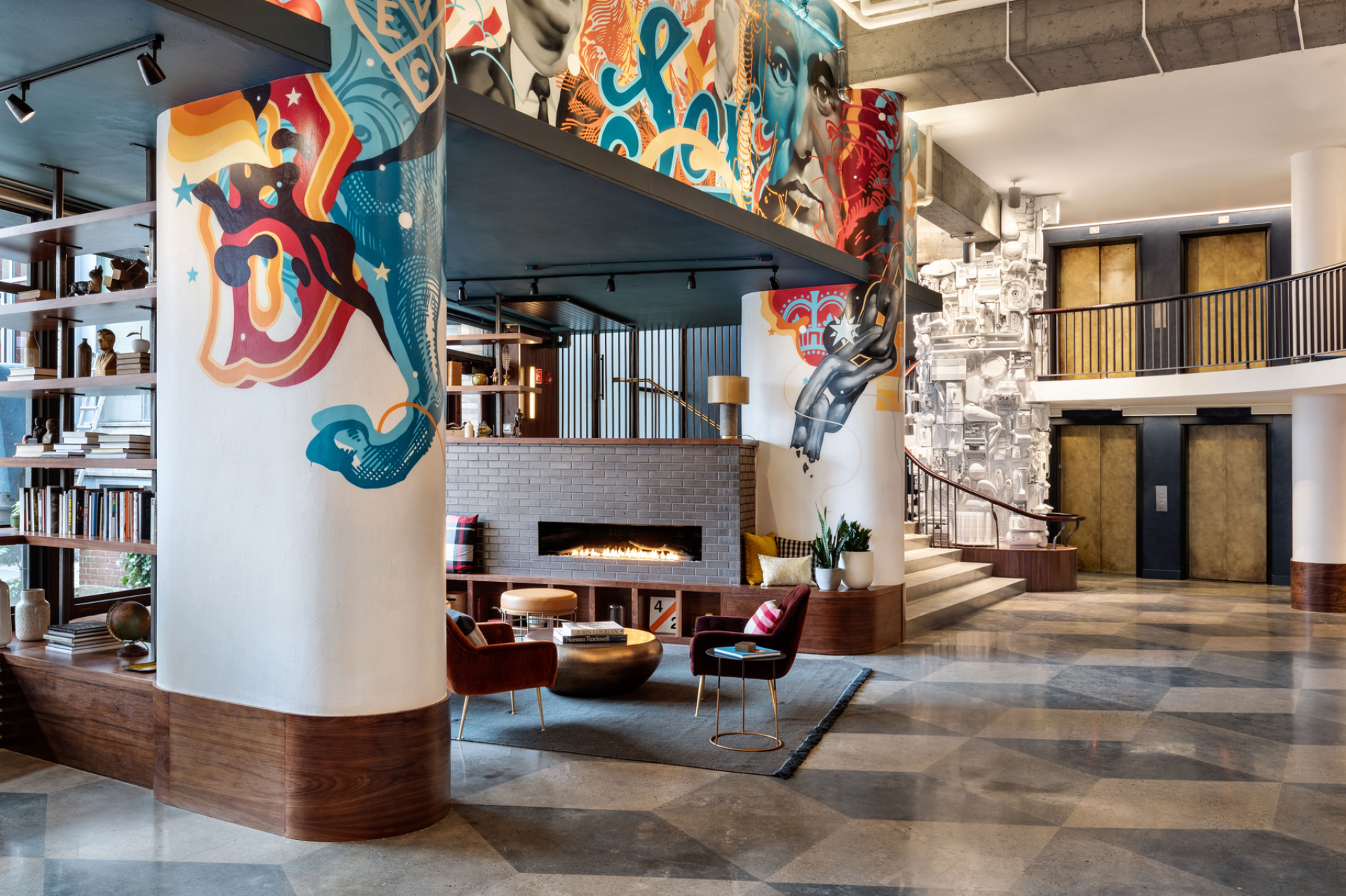 Vibrant interior design of The Revolution Hotel in Boston, featuring artistic murals and modern furnishings celebrating local heritage.