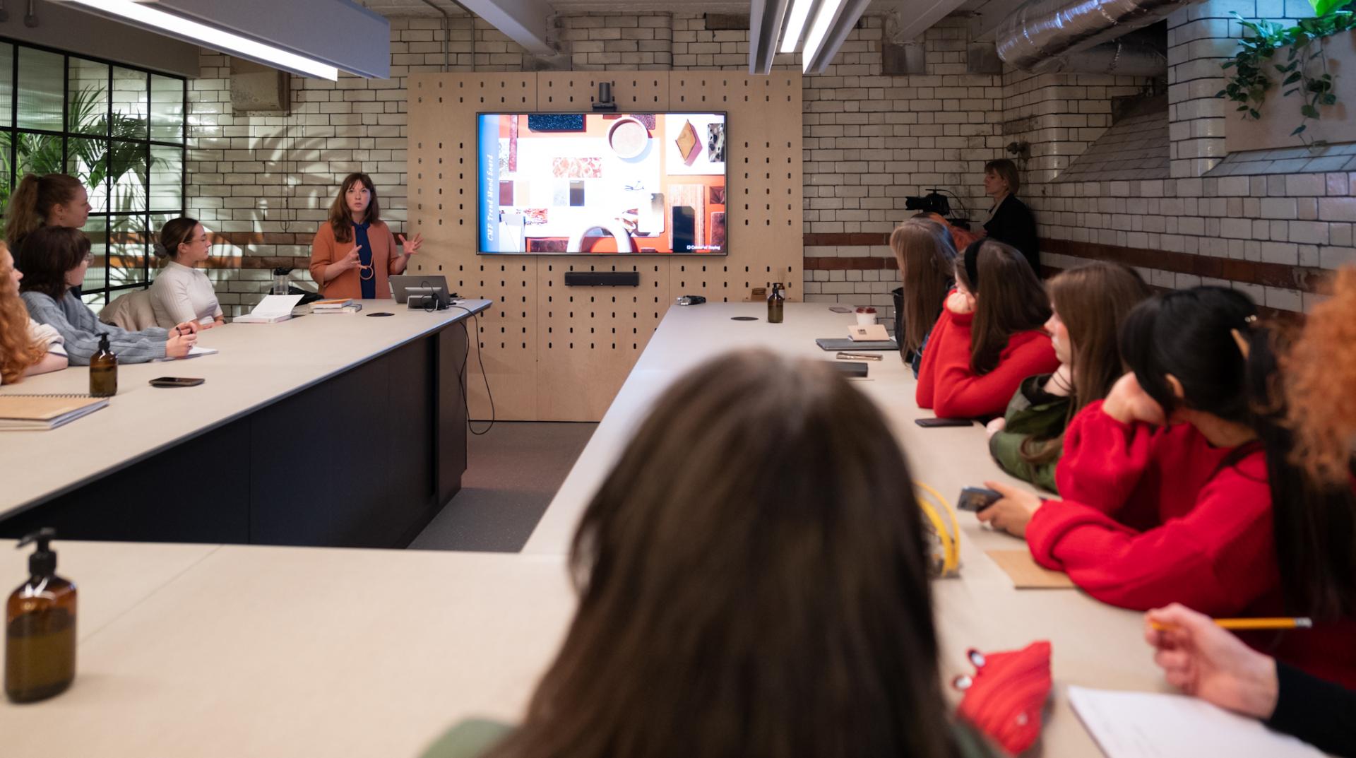 Laura Perryman presenting a colour theory workshop to art students, with a focus on nature's imperfections and the metaverse.