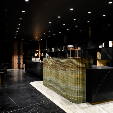 Contemporary showroom interior of Iris Ceramica Group, featuring stylish marble surfaces and elegant lighting in Clerkenwell.