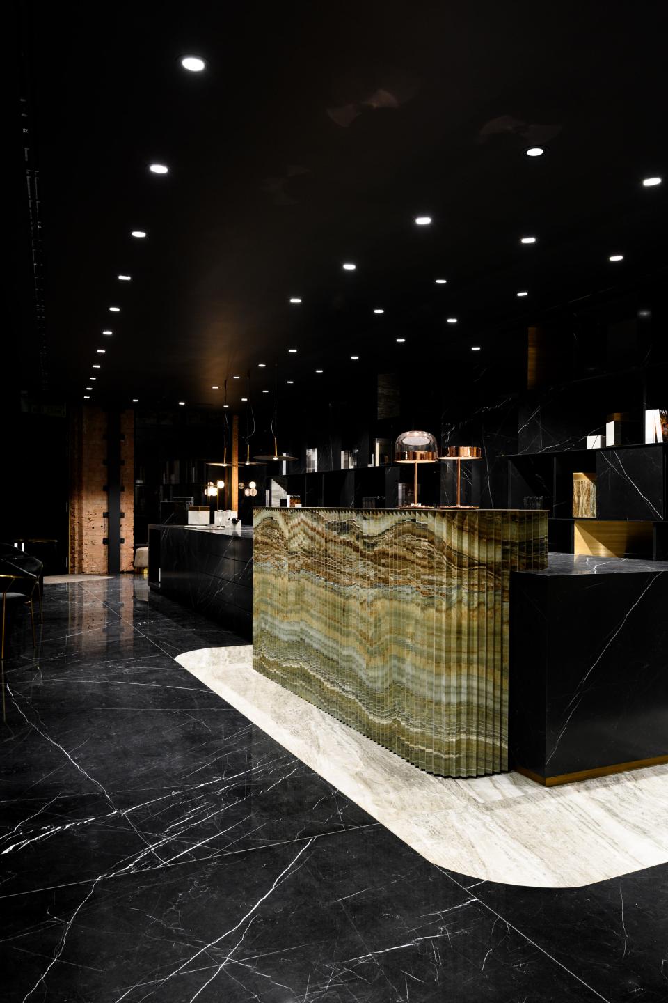 Contemporary showroom interior of Iris Ceramica Group, featuring stylish marble surfaces and elegant lighting in Clerkenwell.