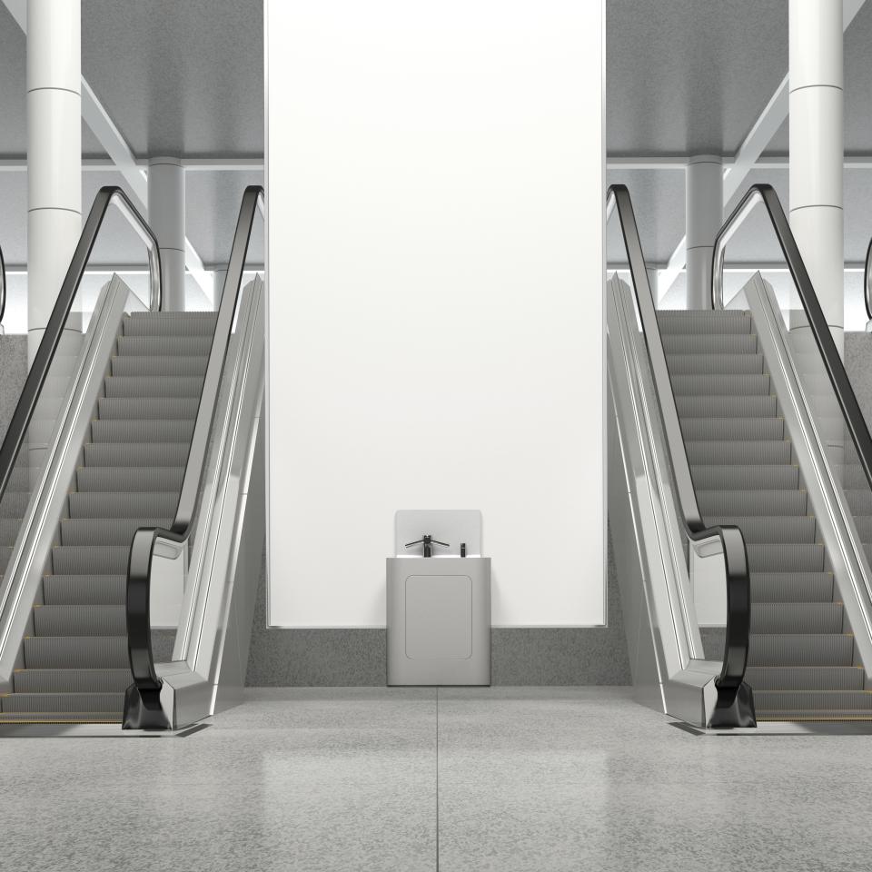 Modern washpod installation between escalators in a public space, emphasizing hygiene and design by CDUK.