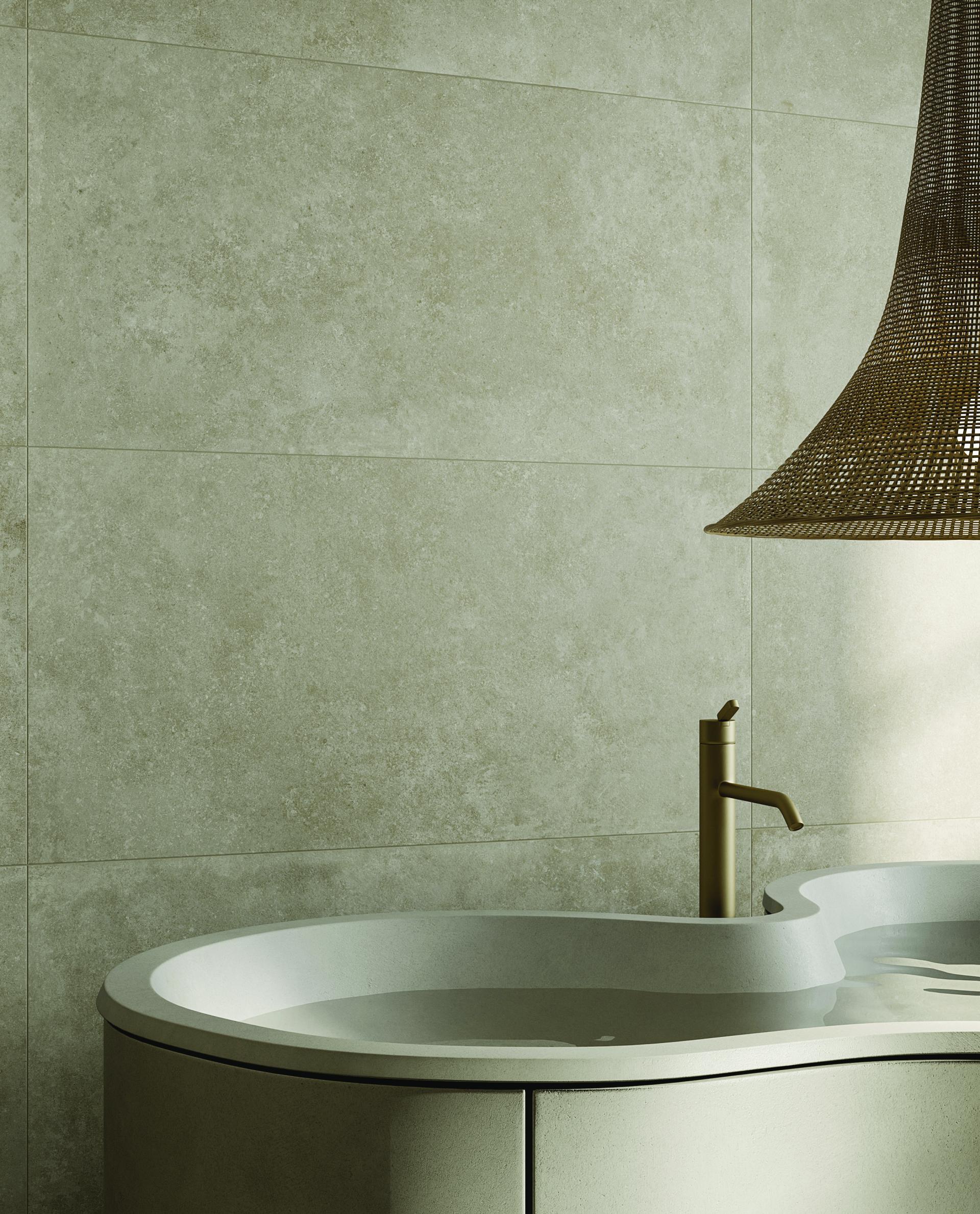 Nordic-inspired bathroom featuring Grestec’s Atacama porcelain tiles in a serene, concrete-like design with a modern sink and faucet.
