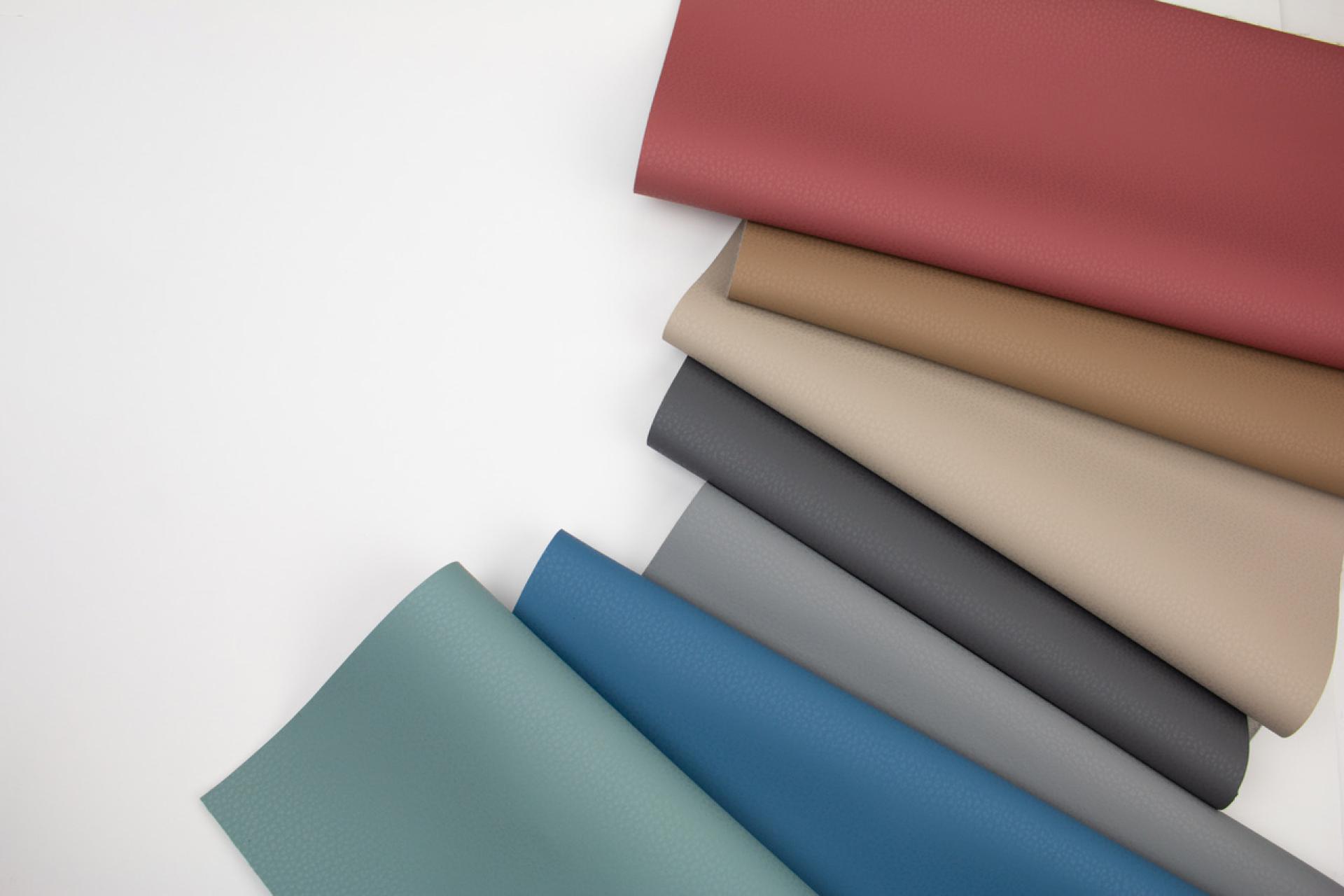 High-performance fabric samples in various colors, showcasing Ultrafabrics' innovative bio-based product preview at 100% Design.