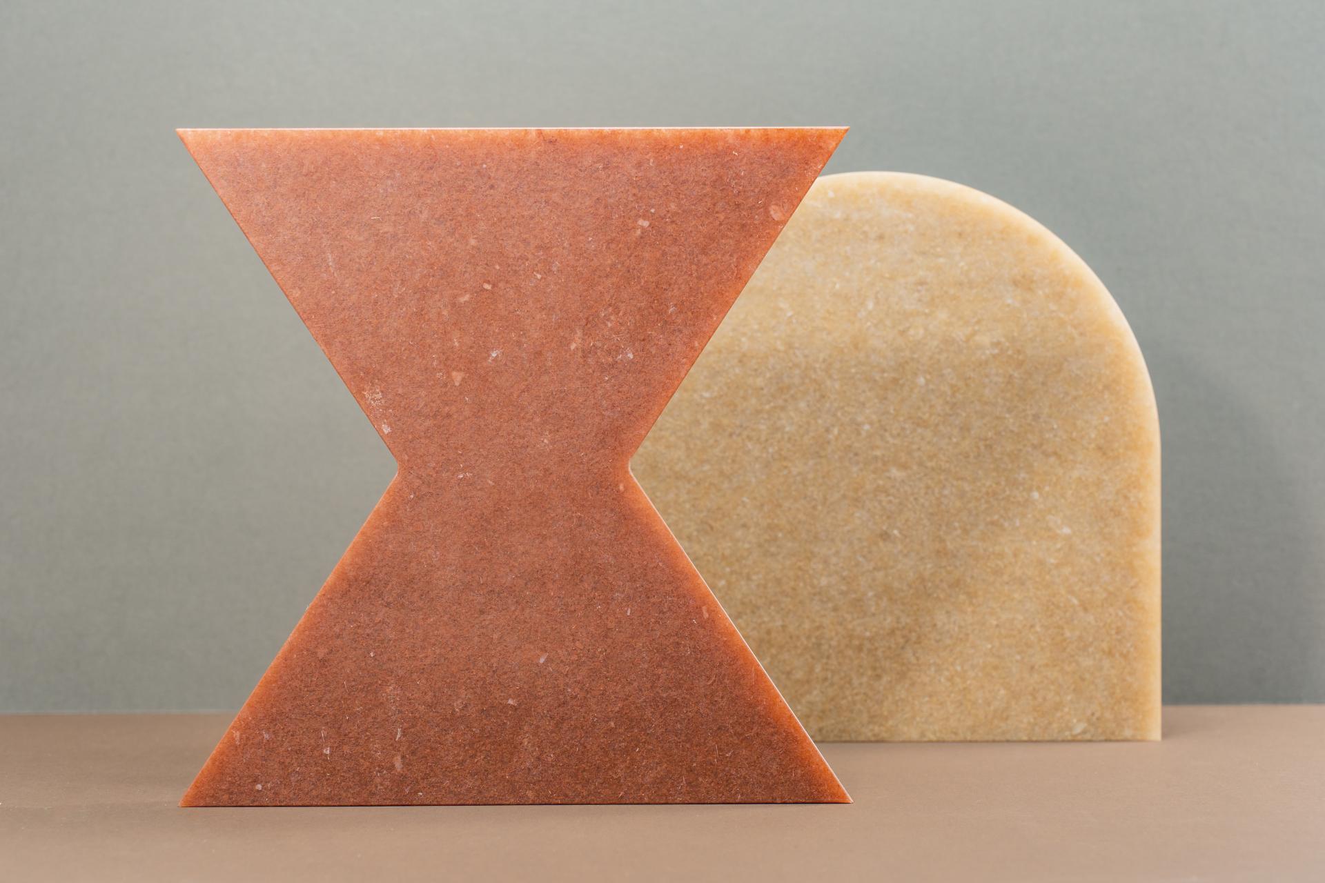 Textured geometrical panels in earthy tones representing Smile Plastics' Earth Collection inspired by the Welsh landscape.