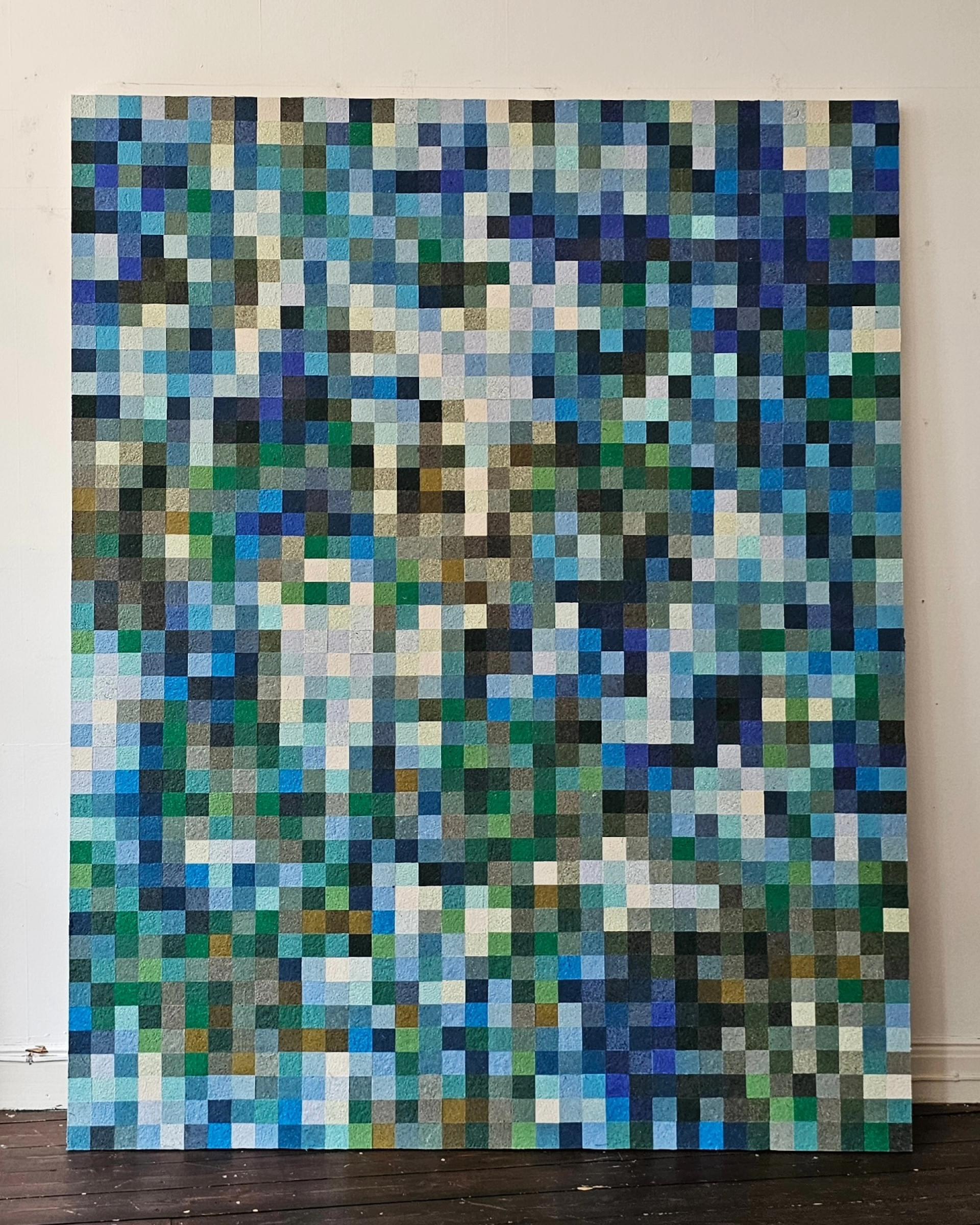 Colorful textile art piece by Sandra Junele, featuring an abstract pattern of interlocking squares in various shades.