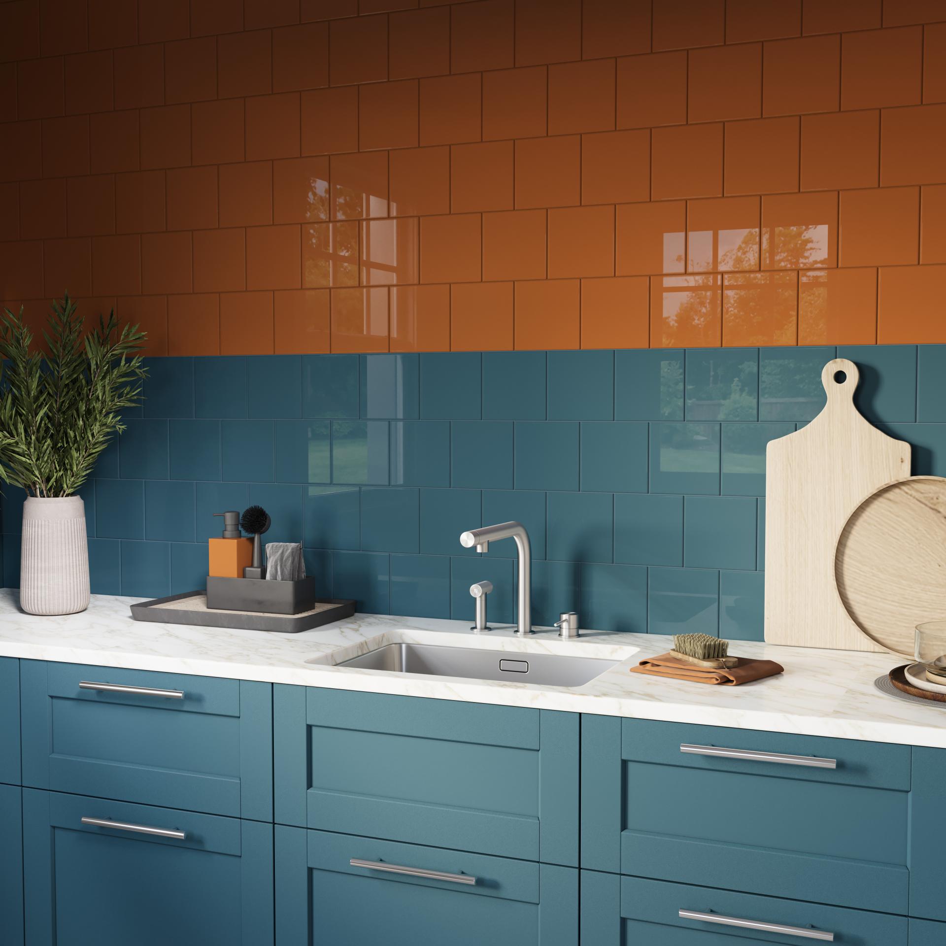Vibrant kitchen scene featuring Parkside's colored tiles in orange and teal, complemented by sleek cabinetry and stylish decor.