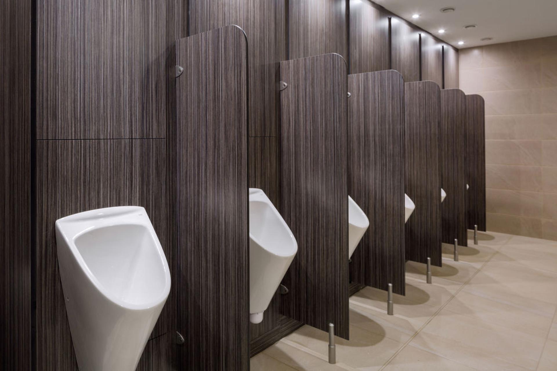Modern washroom facilities featuring multiple urinals, highlighting the recent transformation at Liverpool Street Station.