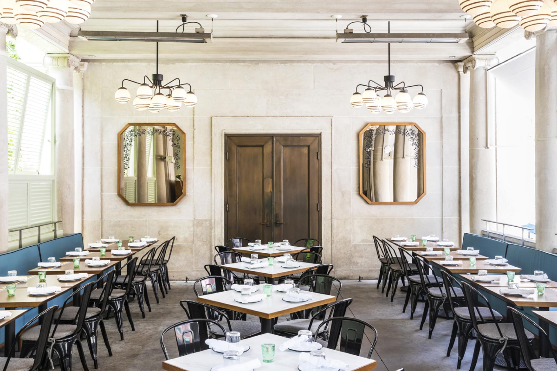 Modern dining area of Bocce restaurant featuring stylish decor and elegant table settings in Union Square, New York.