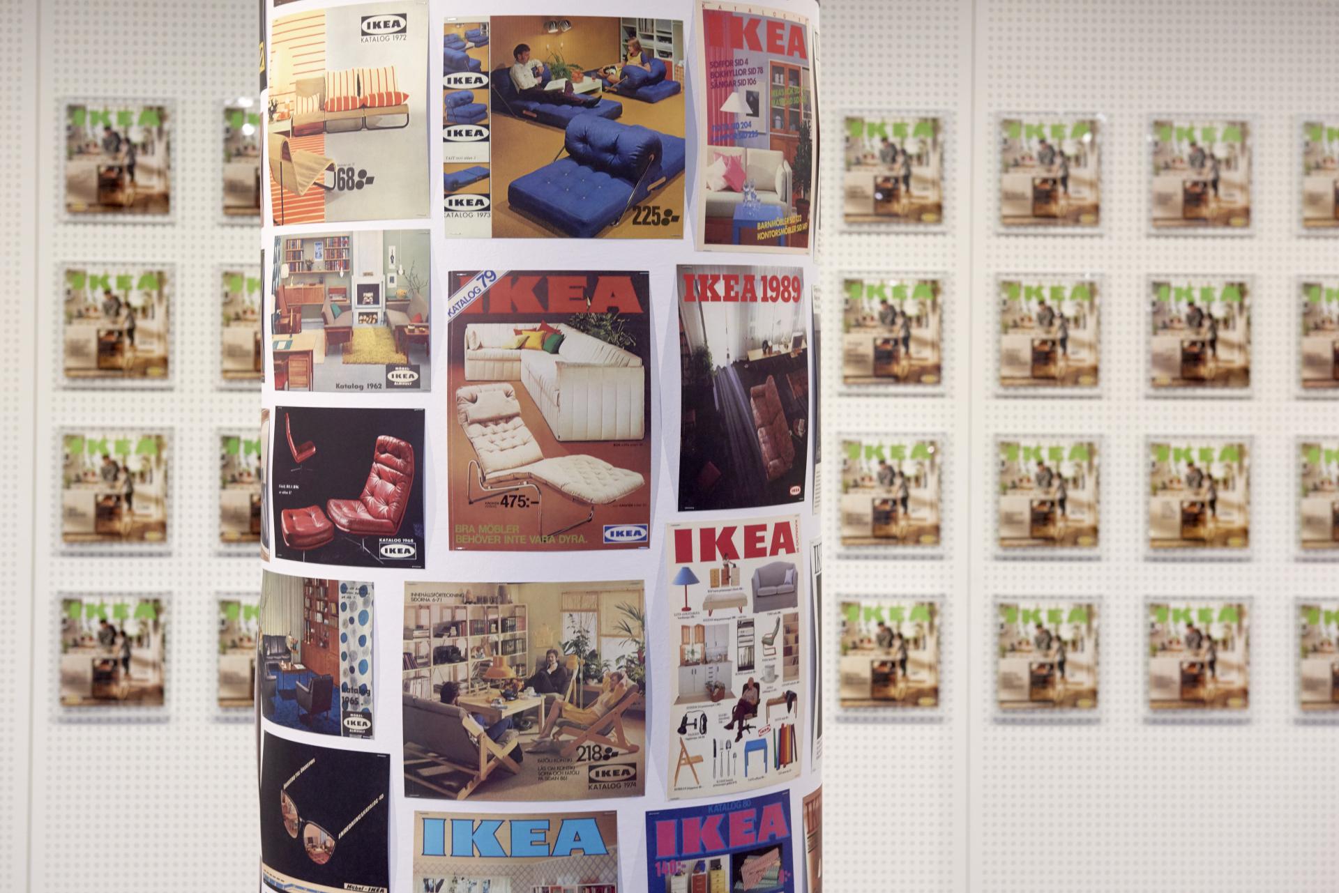 Exhibits of historic IKEA catalogs showcasing furniture designs from various decades at the IKEA Museum in Älmhult.
