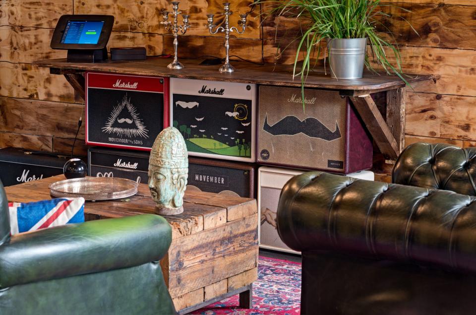 Stylish interior of Movember Foundation’s London office featuring industrial design elements and playful decor.