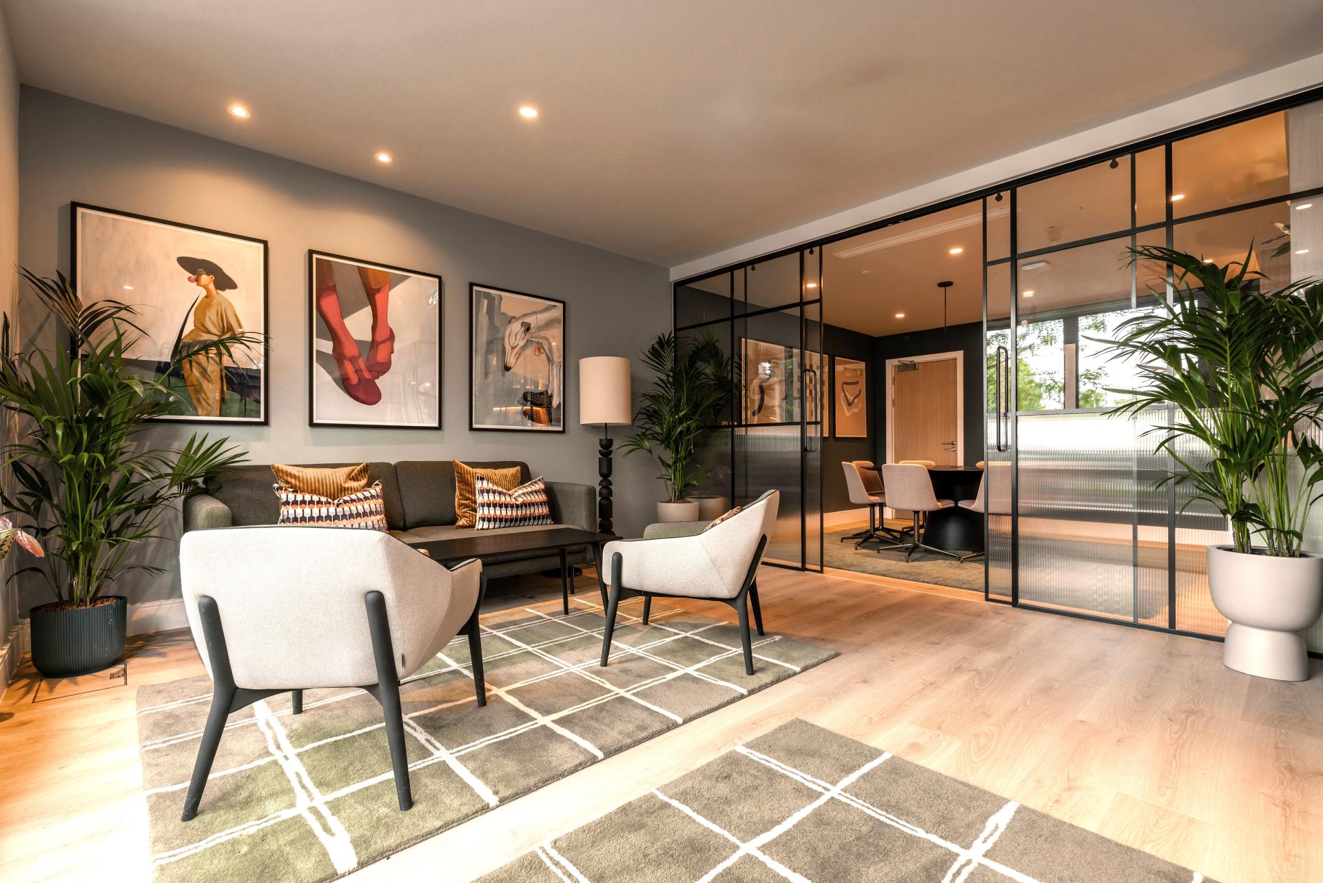 Chic interior design featuring modern furniture and artwork in a co-living space at The Apiary, London.