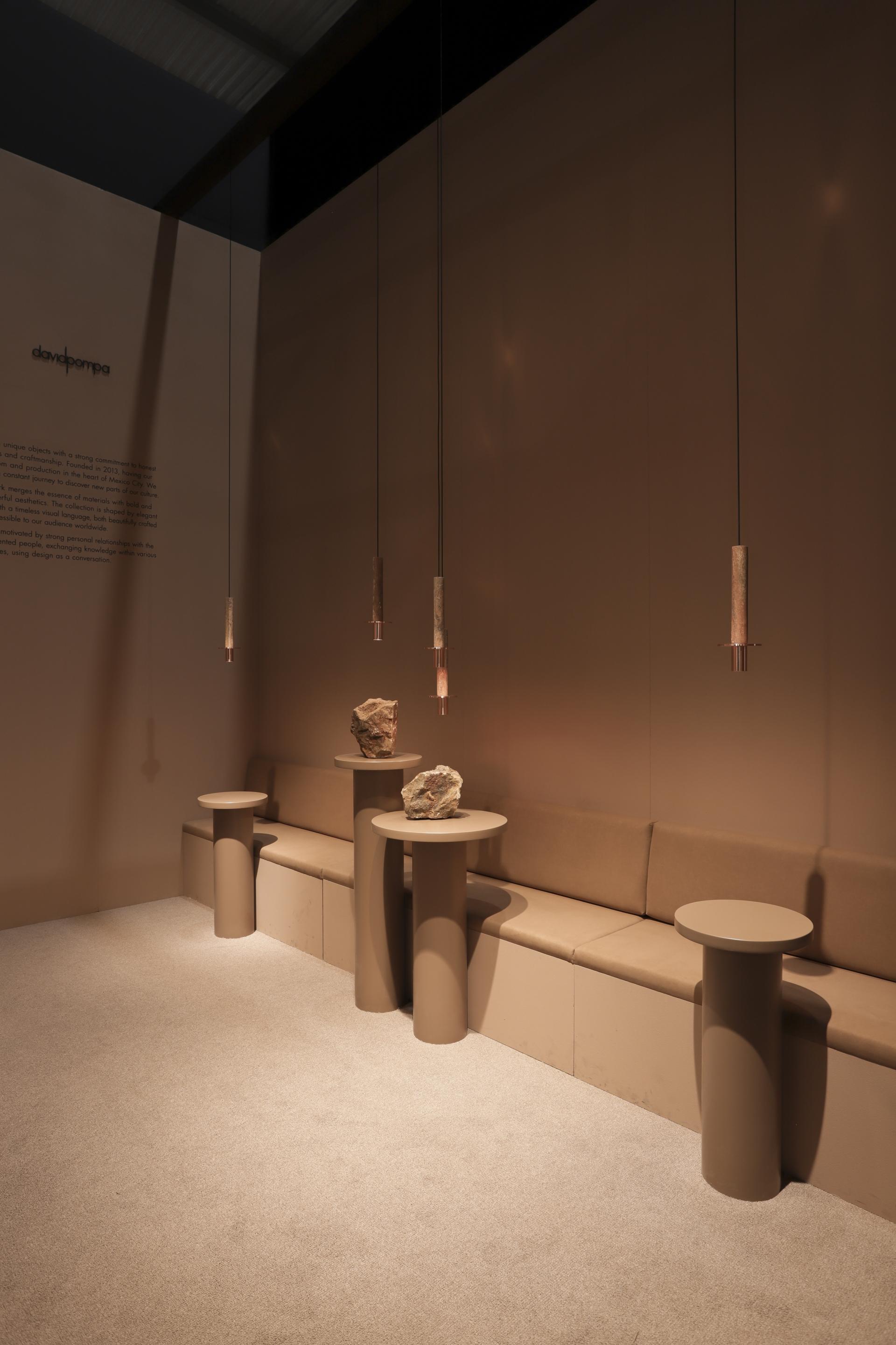 Interior showcasing studio davidpompa's Meta collection with new finishes, featuring minimalist lighting and earthy décor elements.