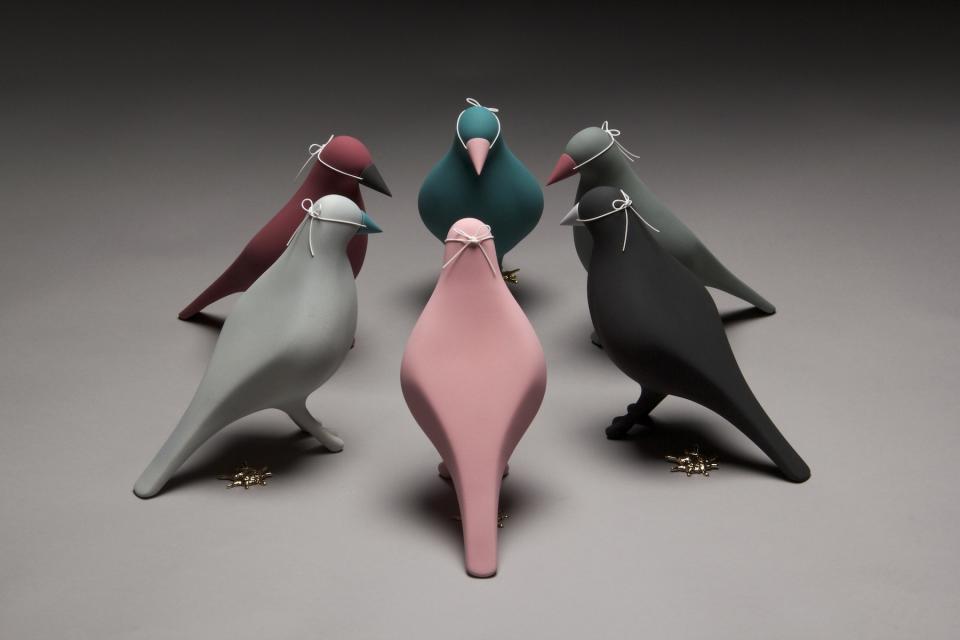 Colorful ceramic birds in various shapes and sizes, showcasing creative craft inspired by the North West of England.