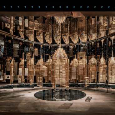 Aspirational workspace design by Karv One, featuring mirrored walls and intricate golden architectural elements in Wenzhou City's tallest tower.