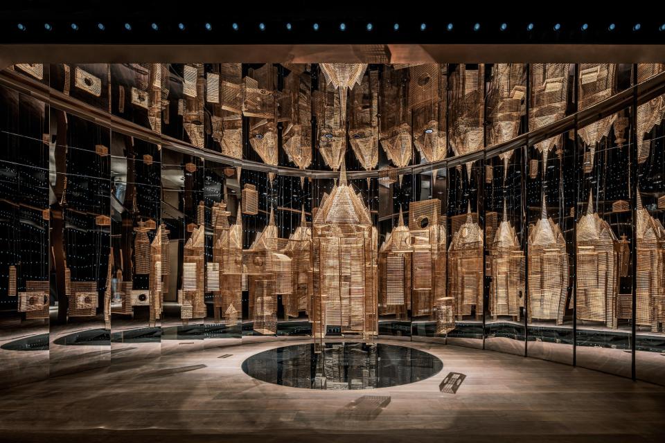 Aspirational workspace design by Karv One, featuring mirrored walls and intricate golden architectural elements in Wenzhou City's tallest tower.